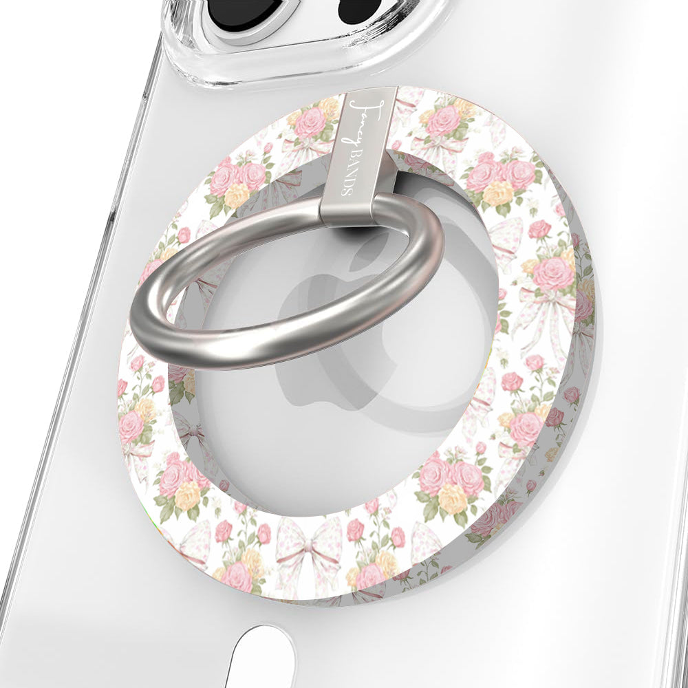 Ribbons and Roses coquette pattern MagSafe phone grip ring with pink roses and white bows on a white background compatible with iPhone and Samsung