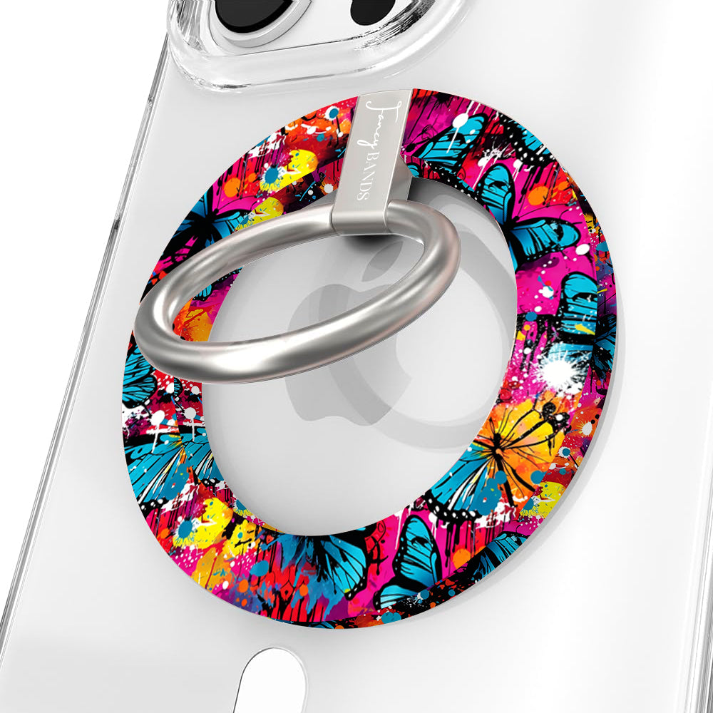 Rebel Wings graffiti butterfly MagSafe phone grip ring with electric blue butterflies, pink and orange paint splatters, and grunge street art design compatible with iPhone and Samsung