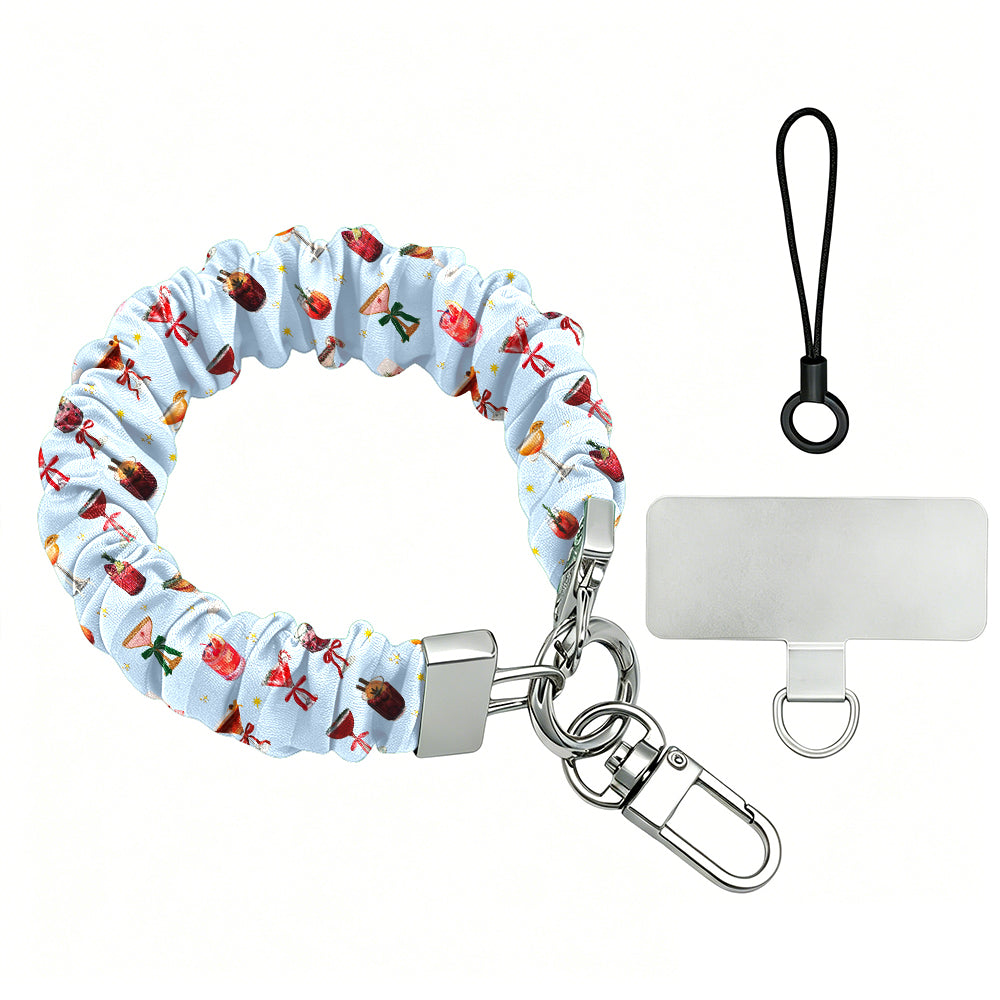 Holiday Spirits, Please? scrunchie phone wrist strap laid flat with silver clasp and phone tab, holiday cocktails and bows on powder blue