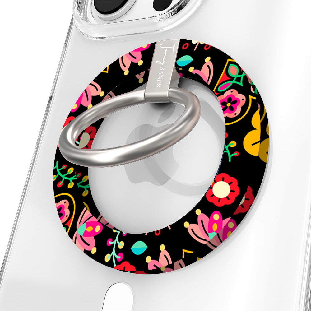 Bloom Bonita folk art floral MagSafe phone grip ring with vibrant pink red yellow and teal flowers on a black background compatible with iPhone and Samsung