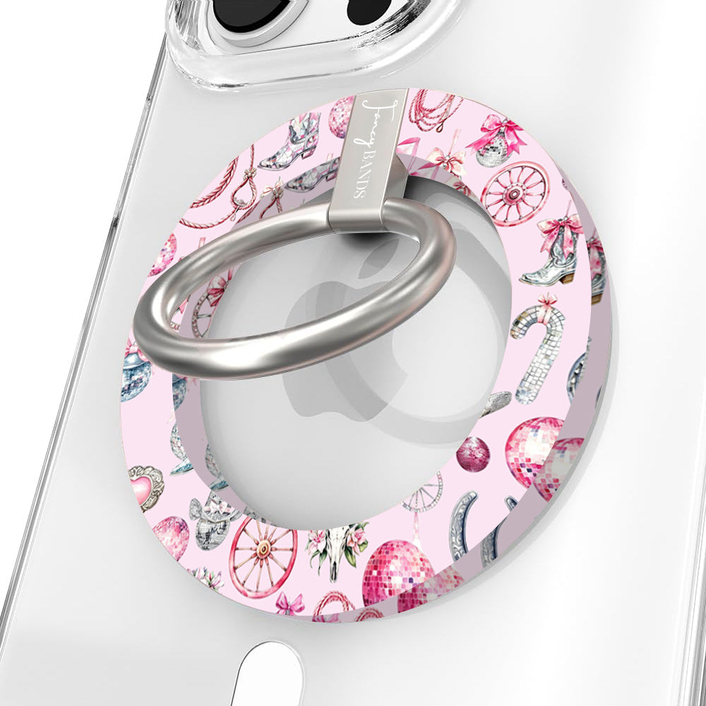 Disco Cowgirl phone grip ring with pink disco balls, cowboy boots, ribbons, and horseshoes on a light pink background compatible with iPhone and Samsung