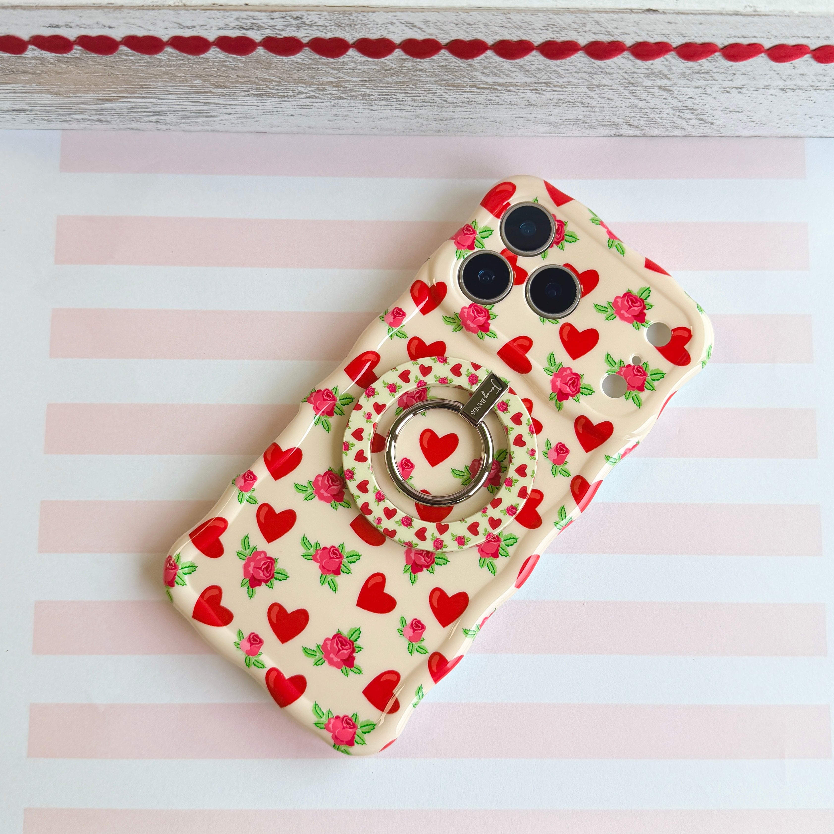 Sweetheart Blooms pattern MagSafe phone grip ring with red hearts and pink roses on cream background compatible with iPhone and Samsung