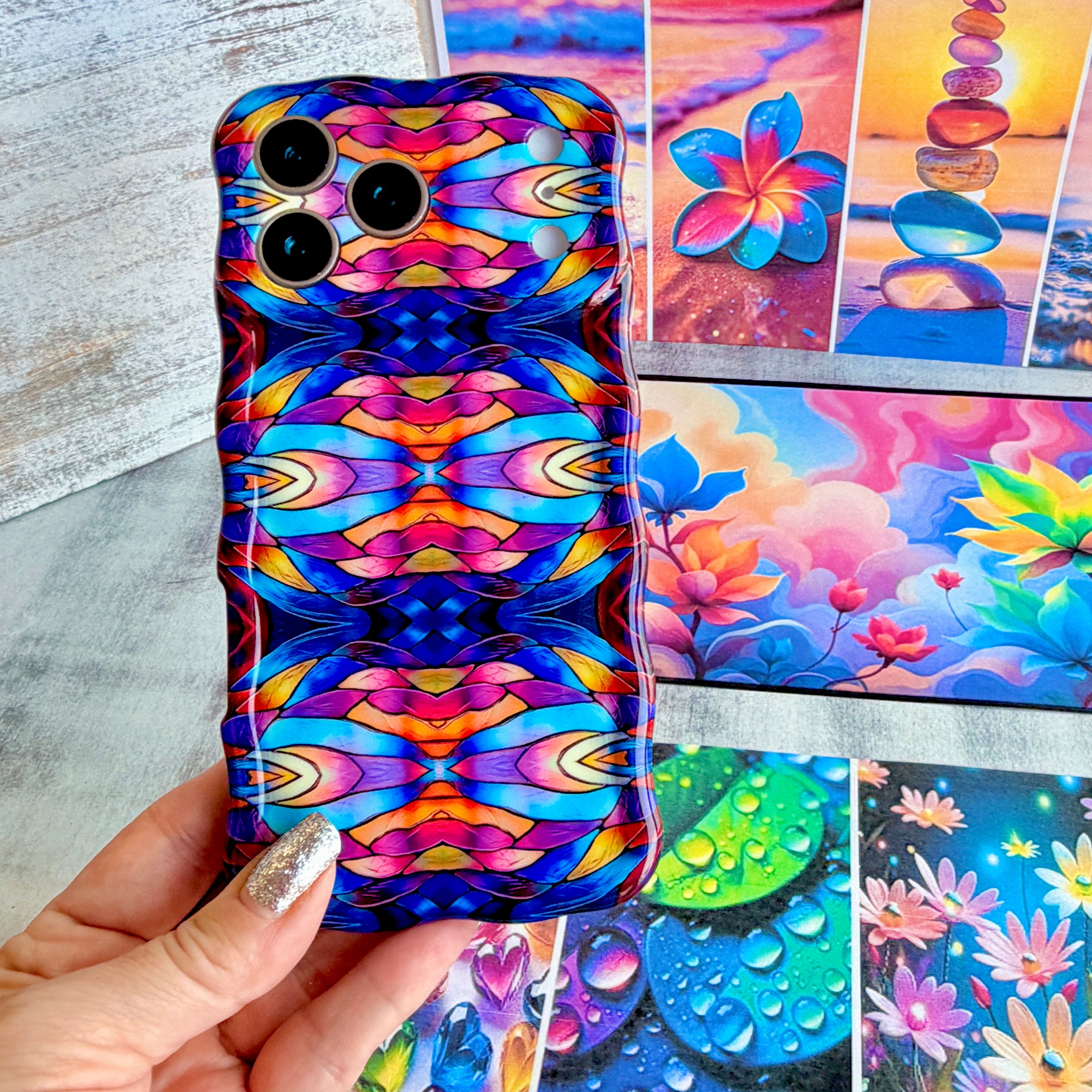 Vibrant wavy iPhone case featuring a symmetrical stained glass pattern in blue, purple, and orange.
