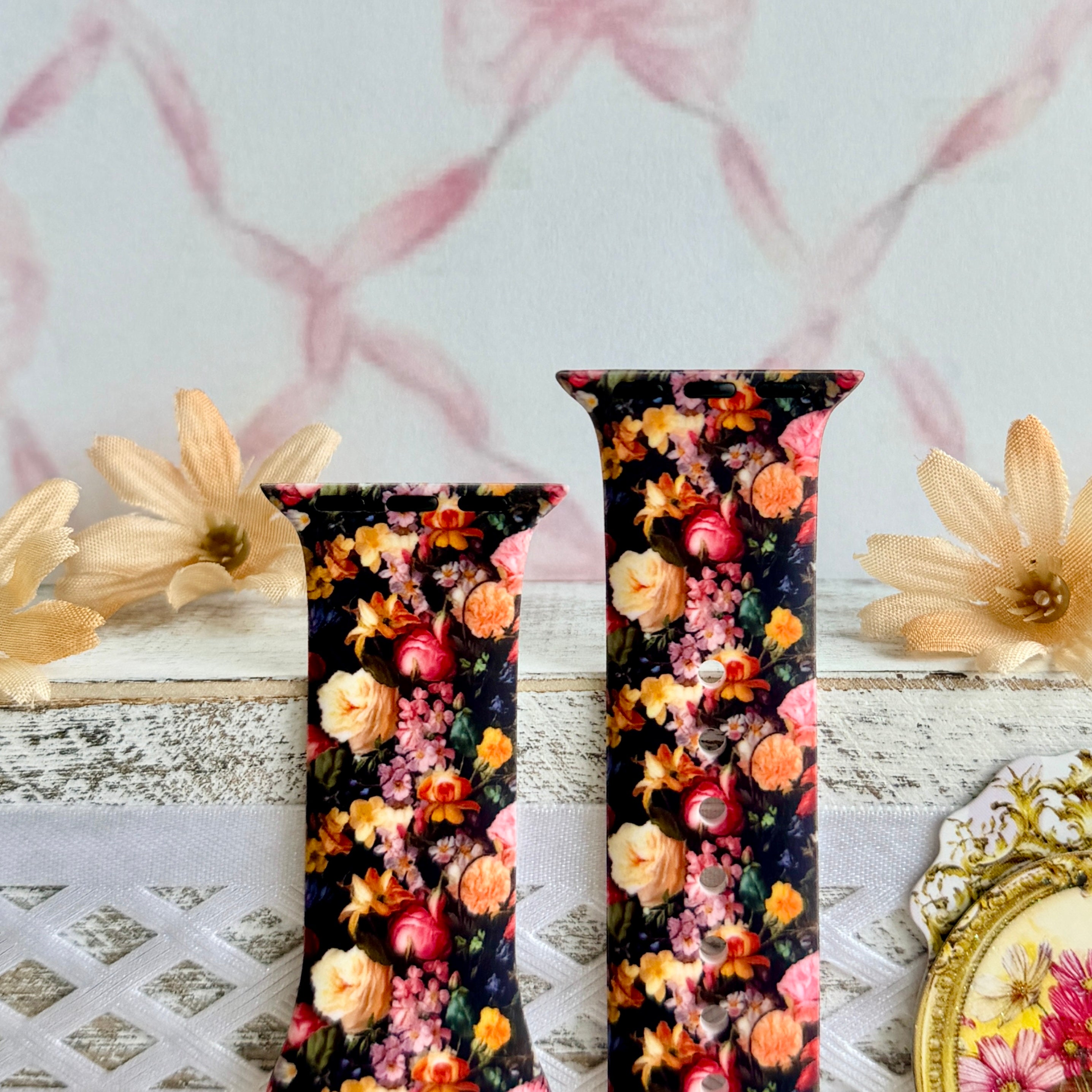 Twilight Bouquet Apple Watch band with vibrant pink, coral, and yellow flowers on black background with white daisies