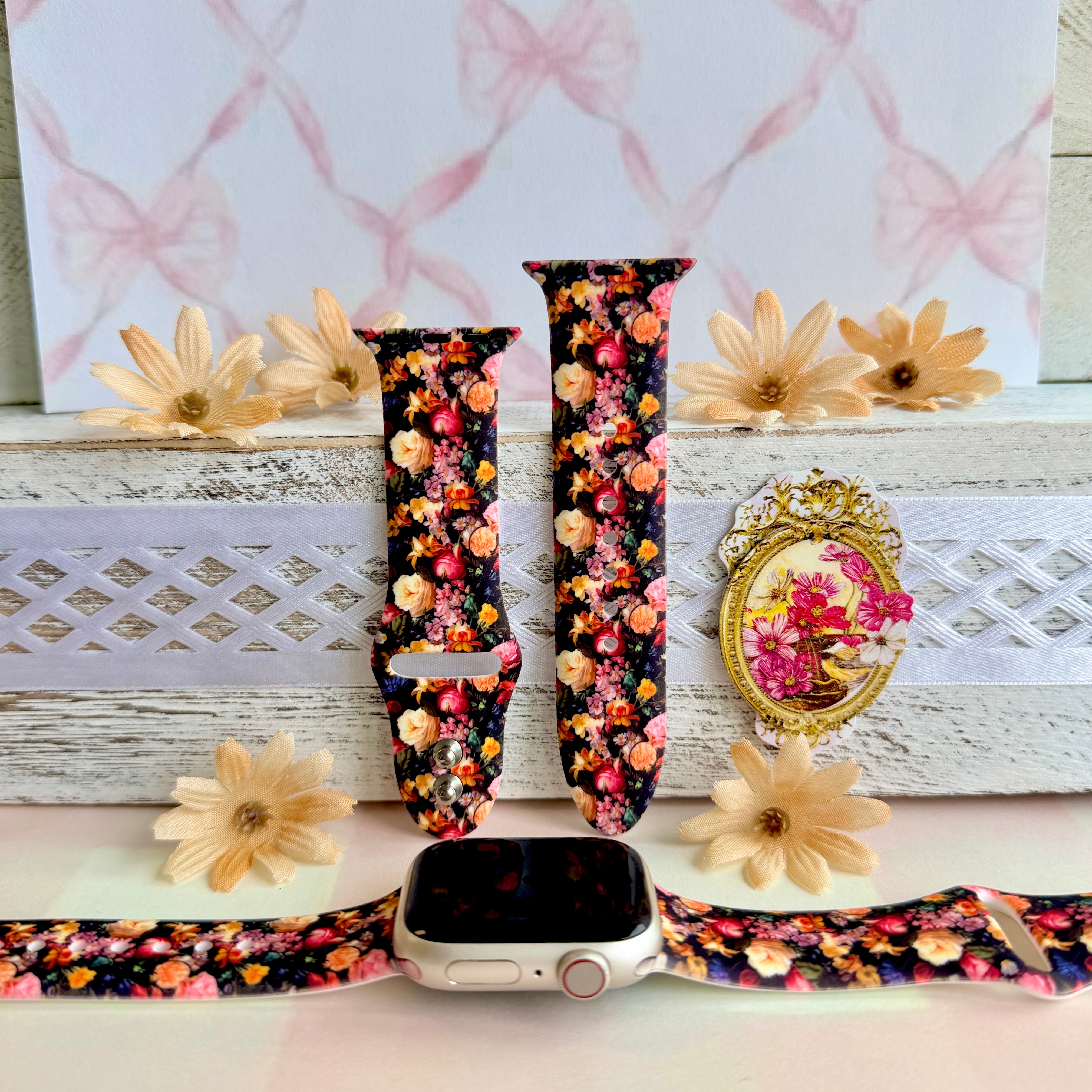 Twilight Bouquet Apple Watch band with vibrant pink, coral, and yellow flowers on black background with white daisies