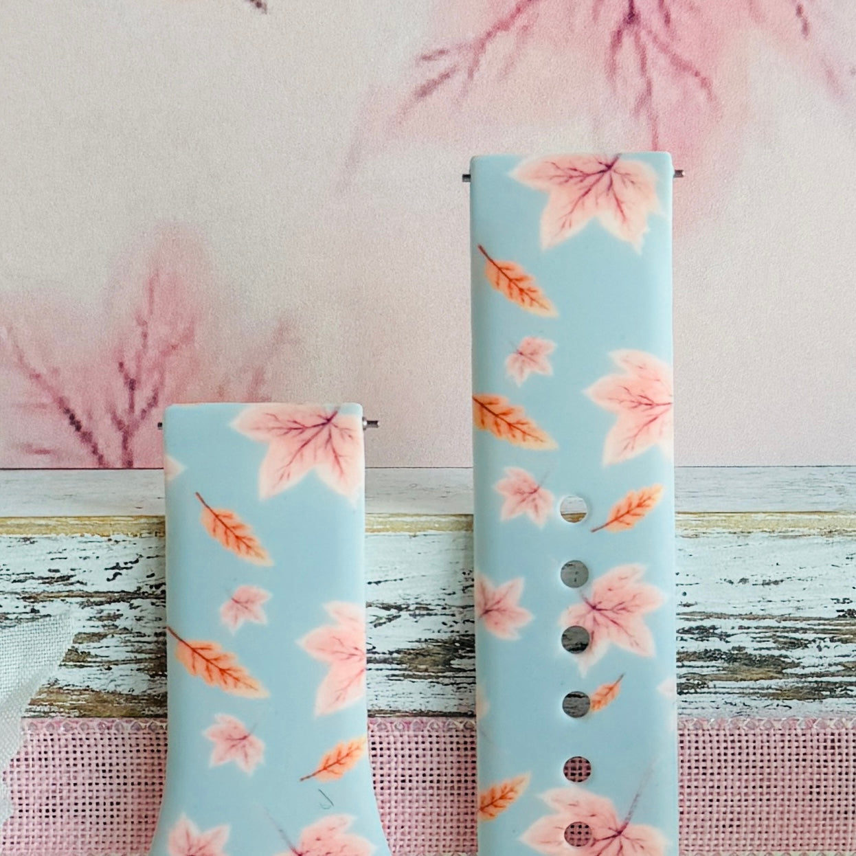 Both sizes of the Autumn Breeze Samsung Galaxy Watch band side by side, close view of the blush maple leaves and coral wheat sprigs.