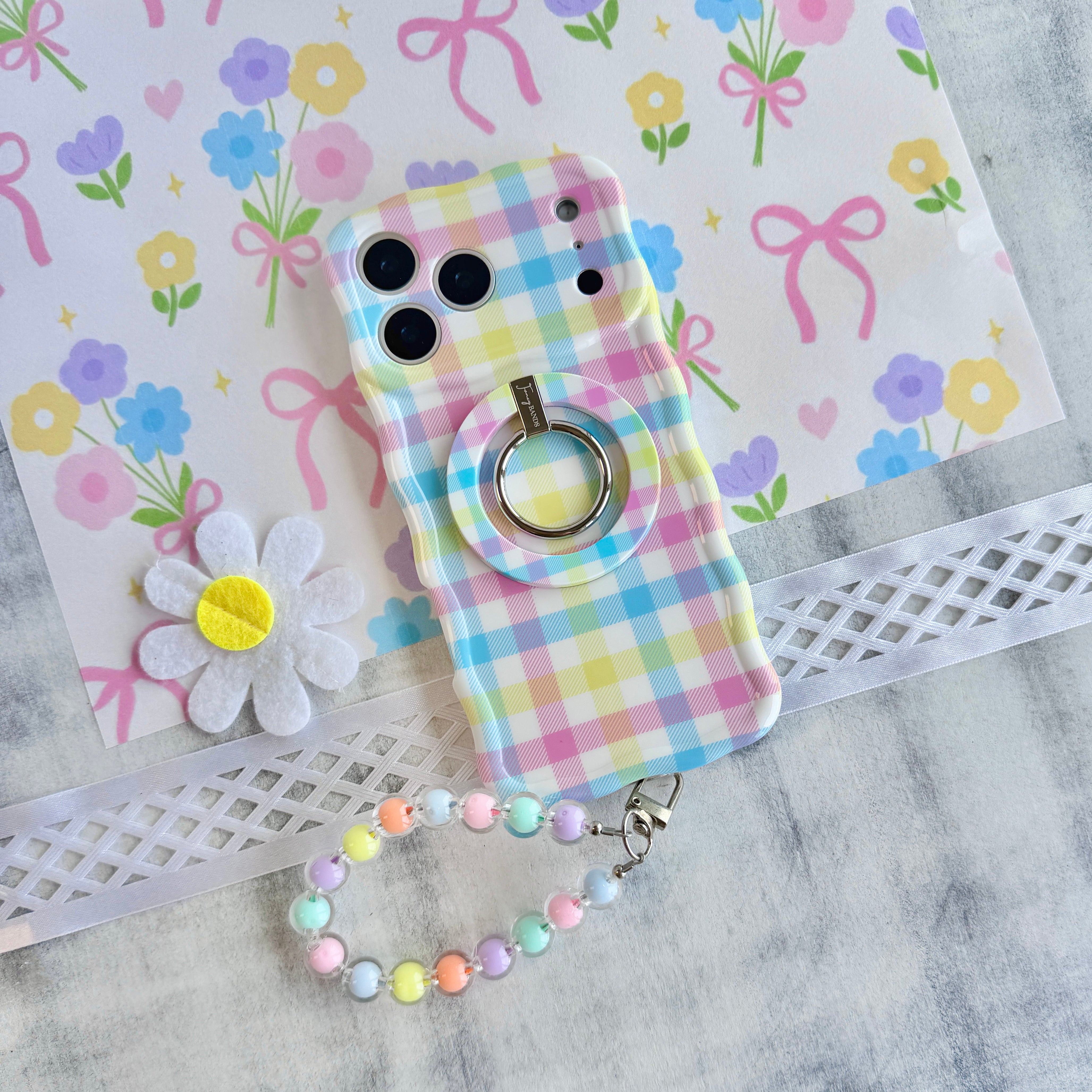 Wavy iPhone case featuring a multi-colored pastel gingham pattern in pink, yellow, green, and blue.