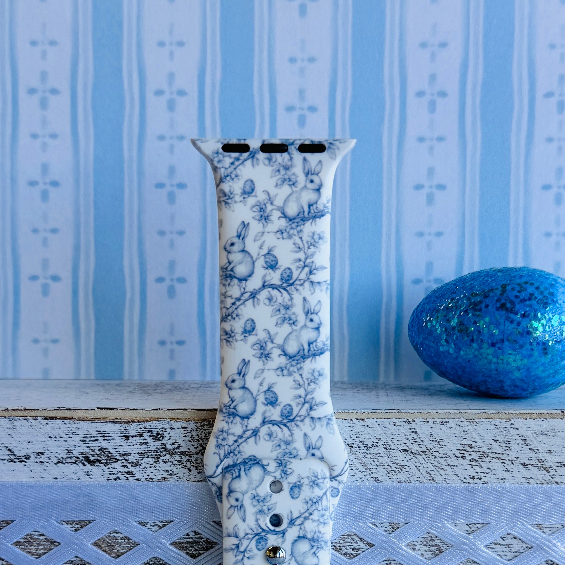 Bluebell Bunny Apple Watch band with blue floral pattern and bunny silhouettes on white background with blue balloons