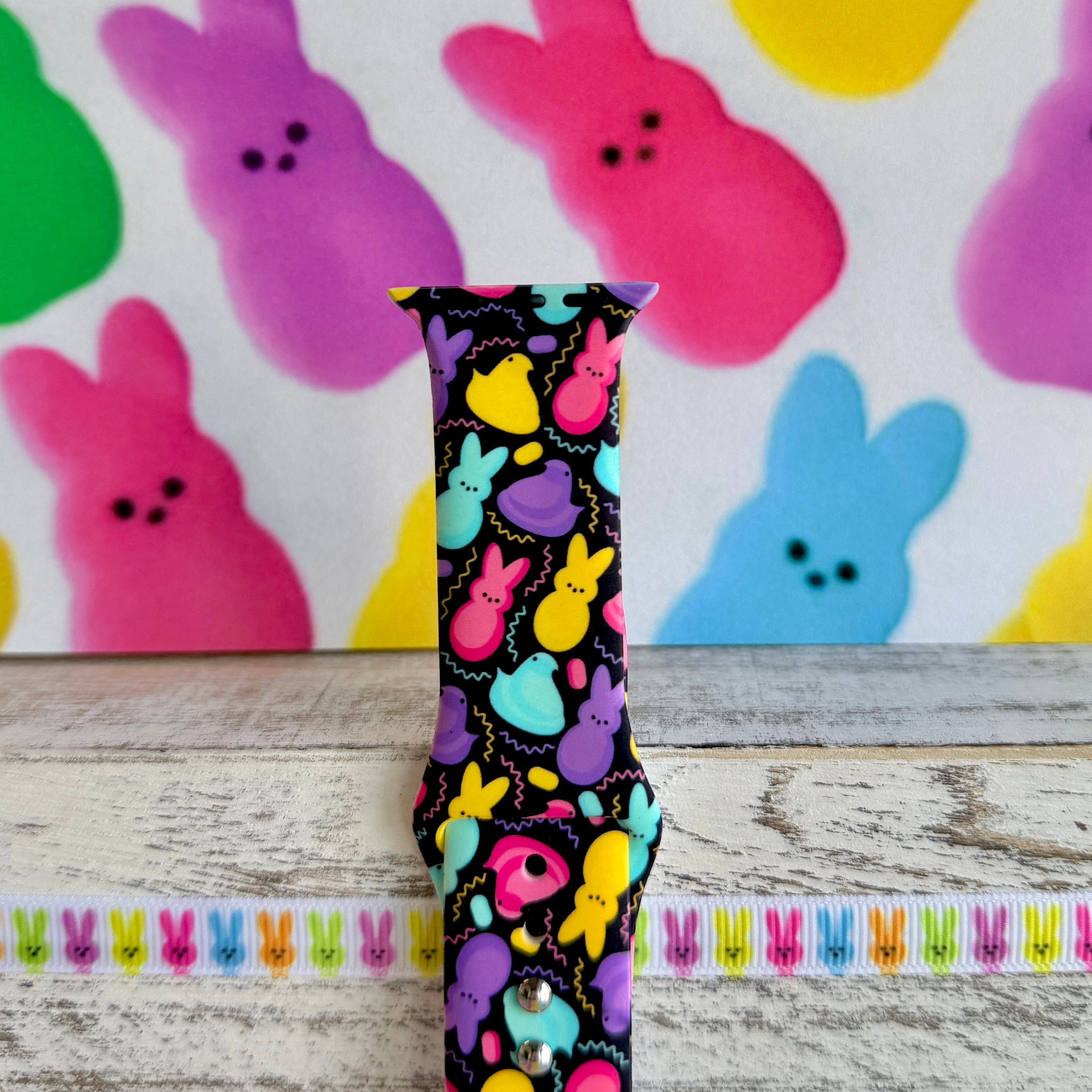 Neon Bunny Bash Apple Watch band with colorful peeps bunnies in pink, purple, yellow, and turquoise on black background