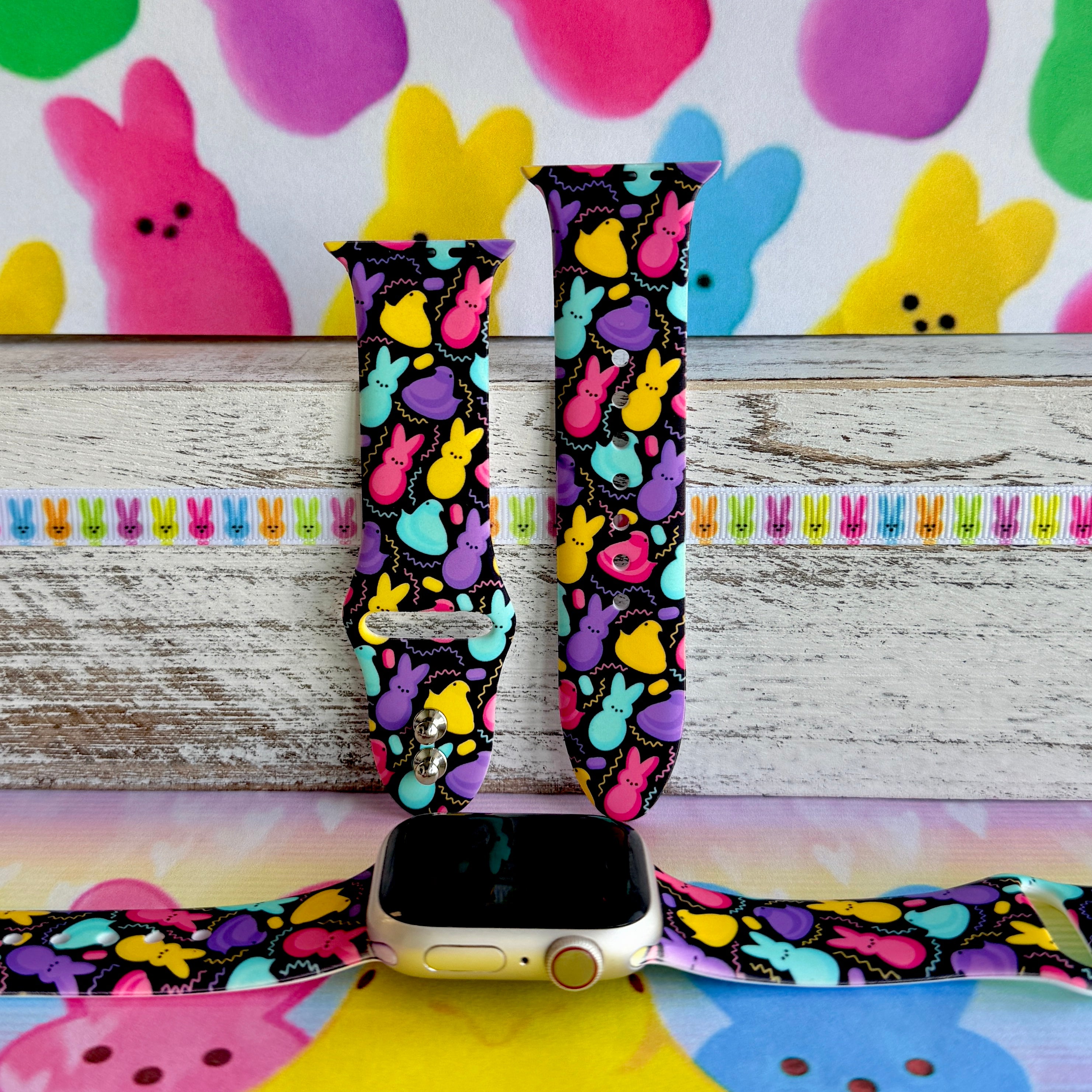 Neon Bunny Bash Apple Watch band with colorful peeps bunnies in pink, purple, yellow, and turquoise on black background