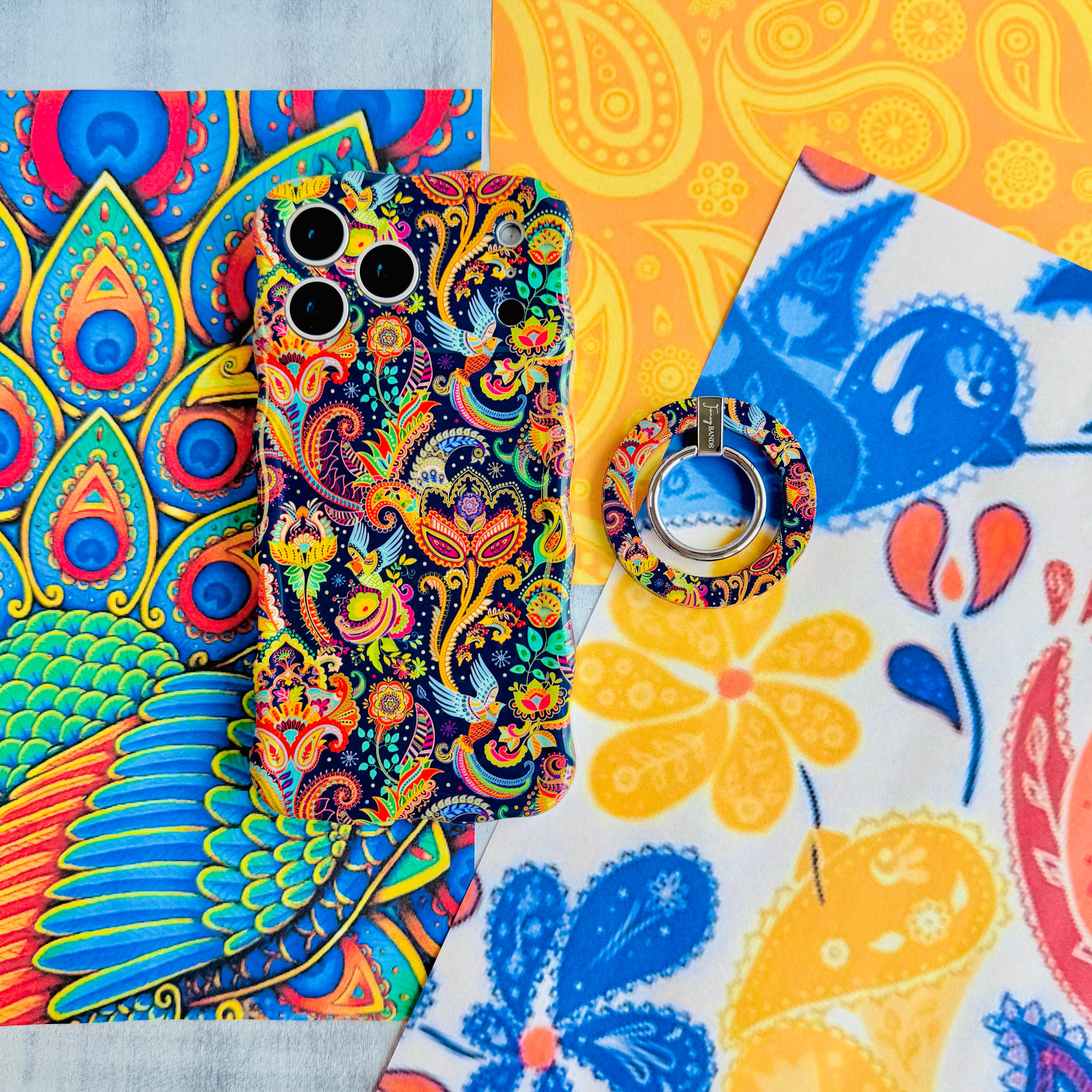 Paisley Birdsong bohemian MagSafe phone grip ring with intricate jewel-toned paisley, flowers, and birds on a deep navy background compatible with iPhone and Samsung