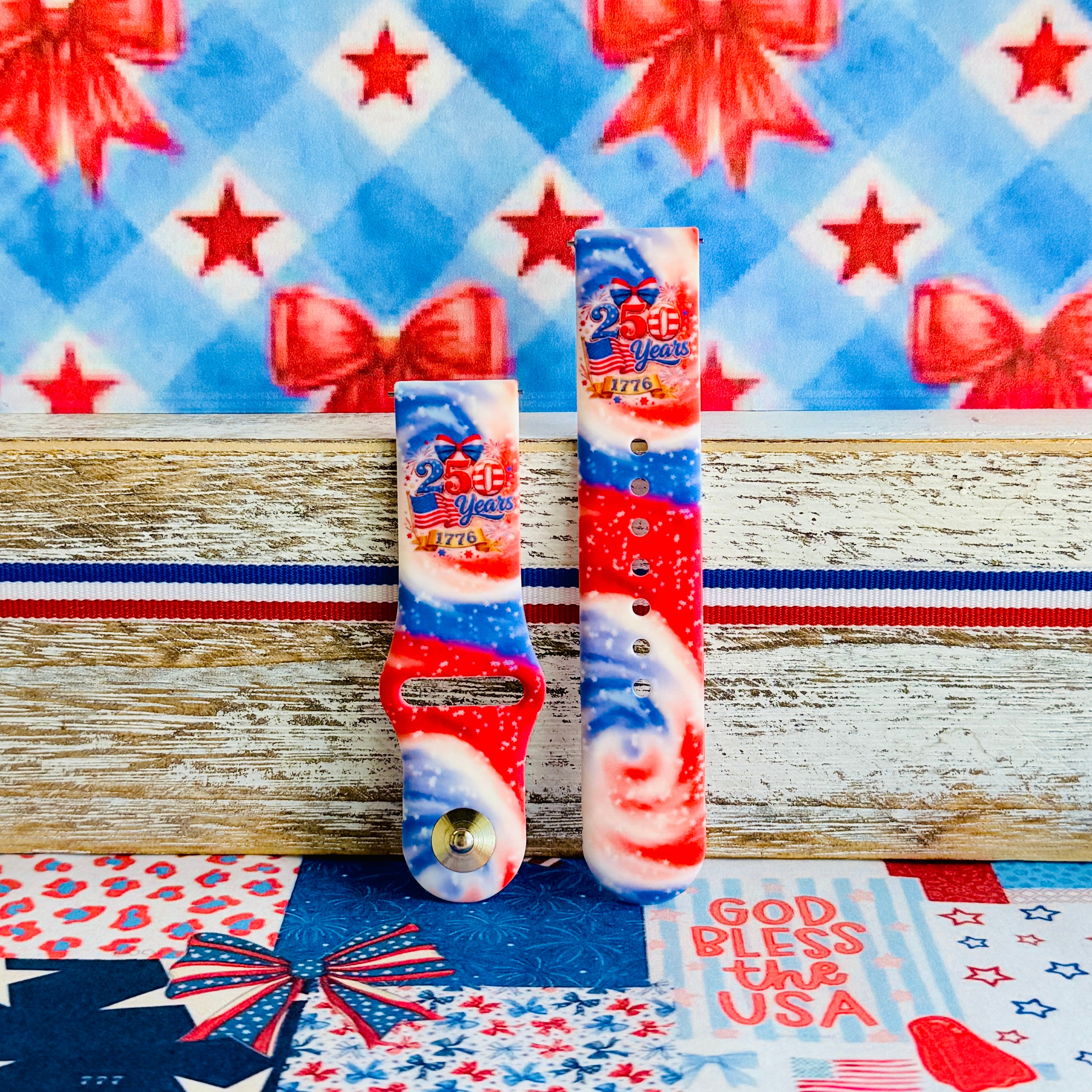 Sweet Freedom 250 silicone Samsung Galaxy Watch band celebrating America's 250th anniversary with "250 Years 1776" emblem, American flag, fireworks, red bow, and red, white, and blue tie-dye swirl with star sparkle, shown displayed and worn against a patriotic 4th of July backdrop.