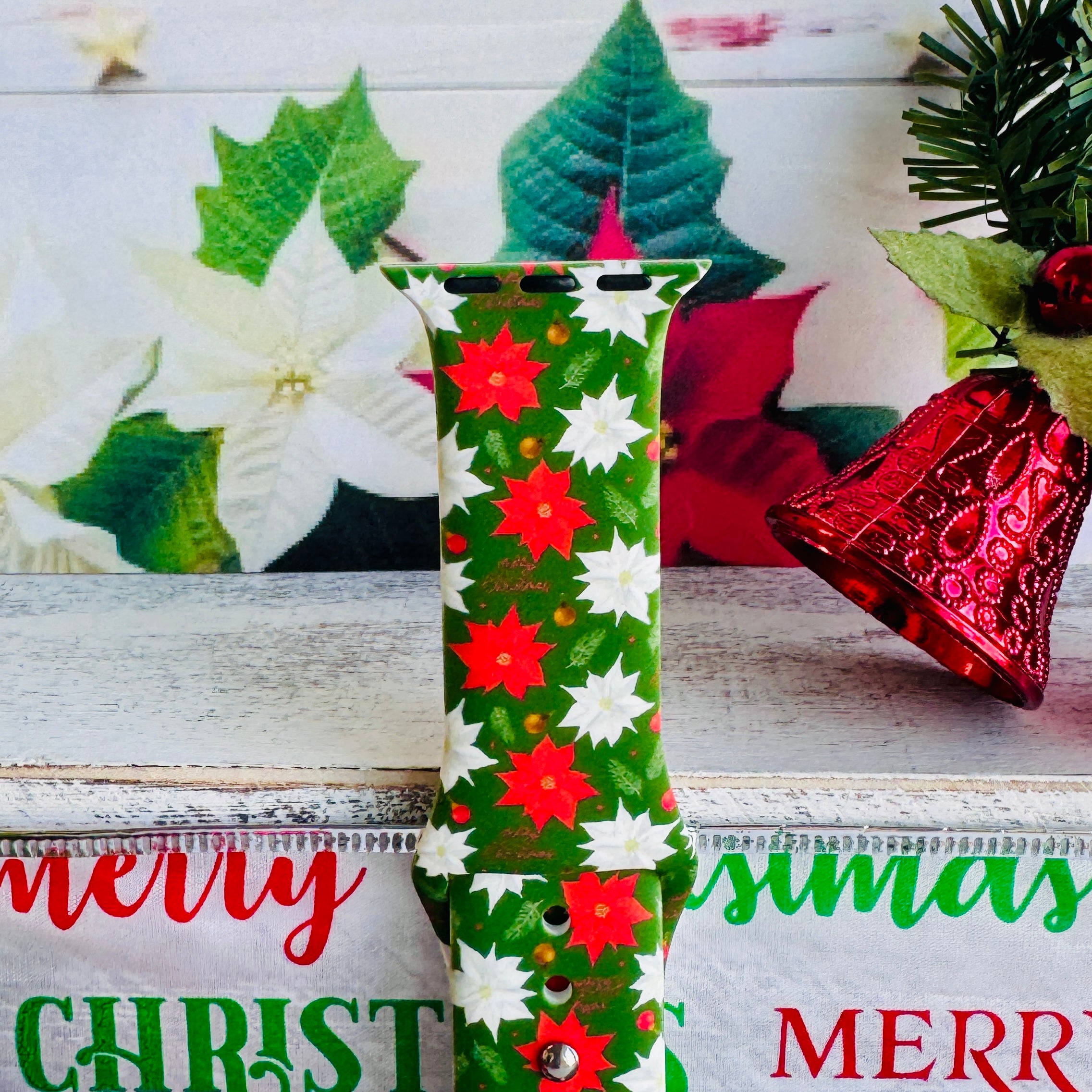 Poinsettia Pines Apple Watch band styled with classic Christmas decorations, poinsettias, and holiday bells