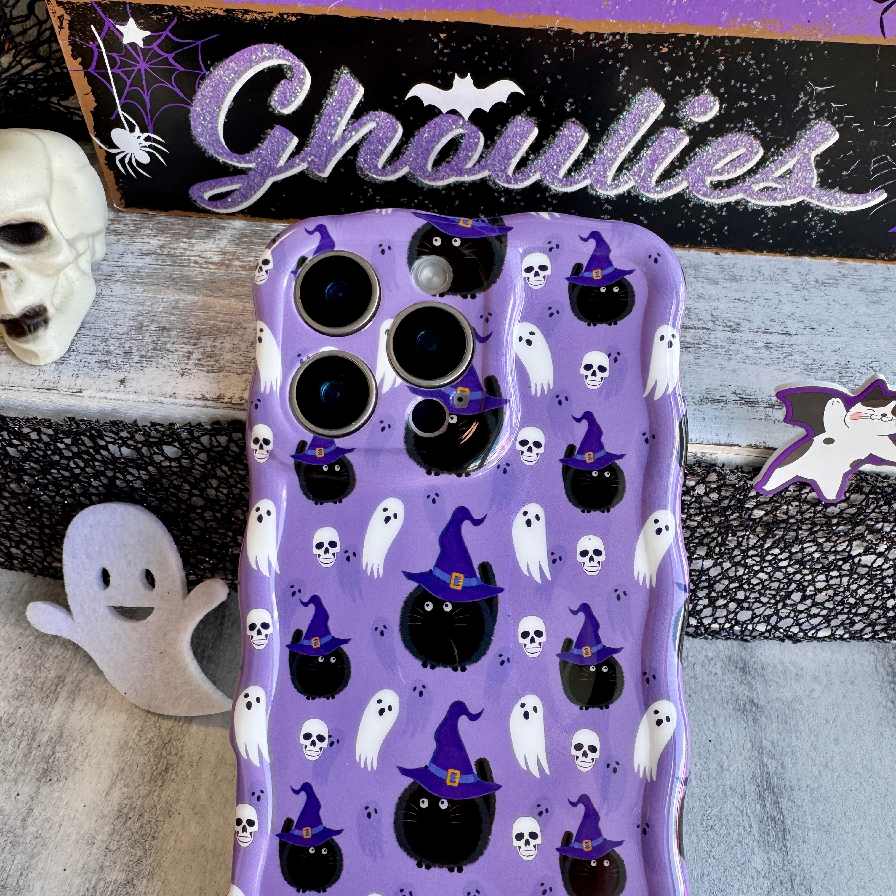 Close-up of glossy wavy edge on Ghostly Whiskers iPhone case