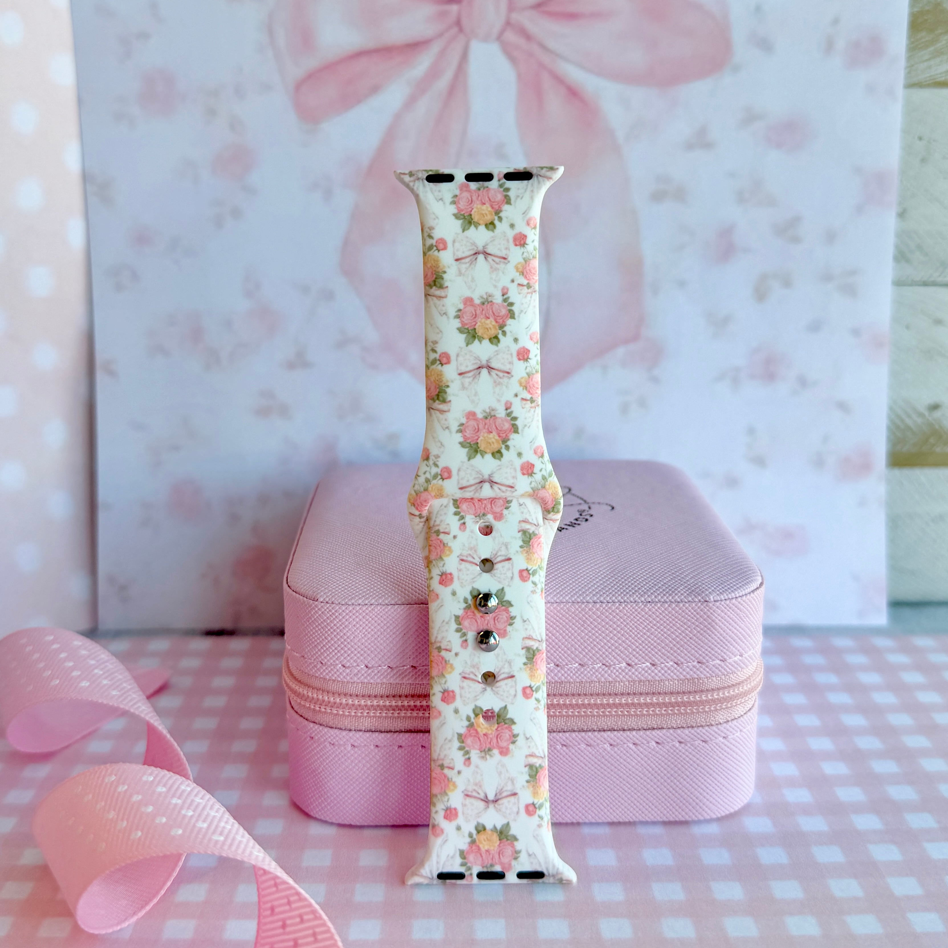 Ribbons & Roses Apple Watch band with pink roses and ribbon bows on cream background with pink rose and ribbon decorations