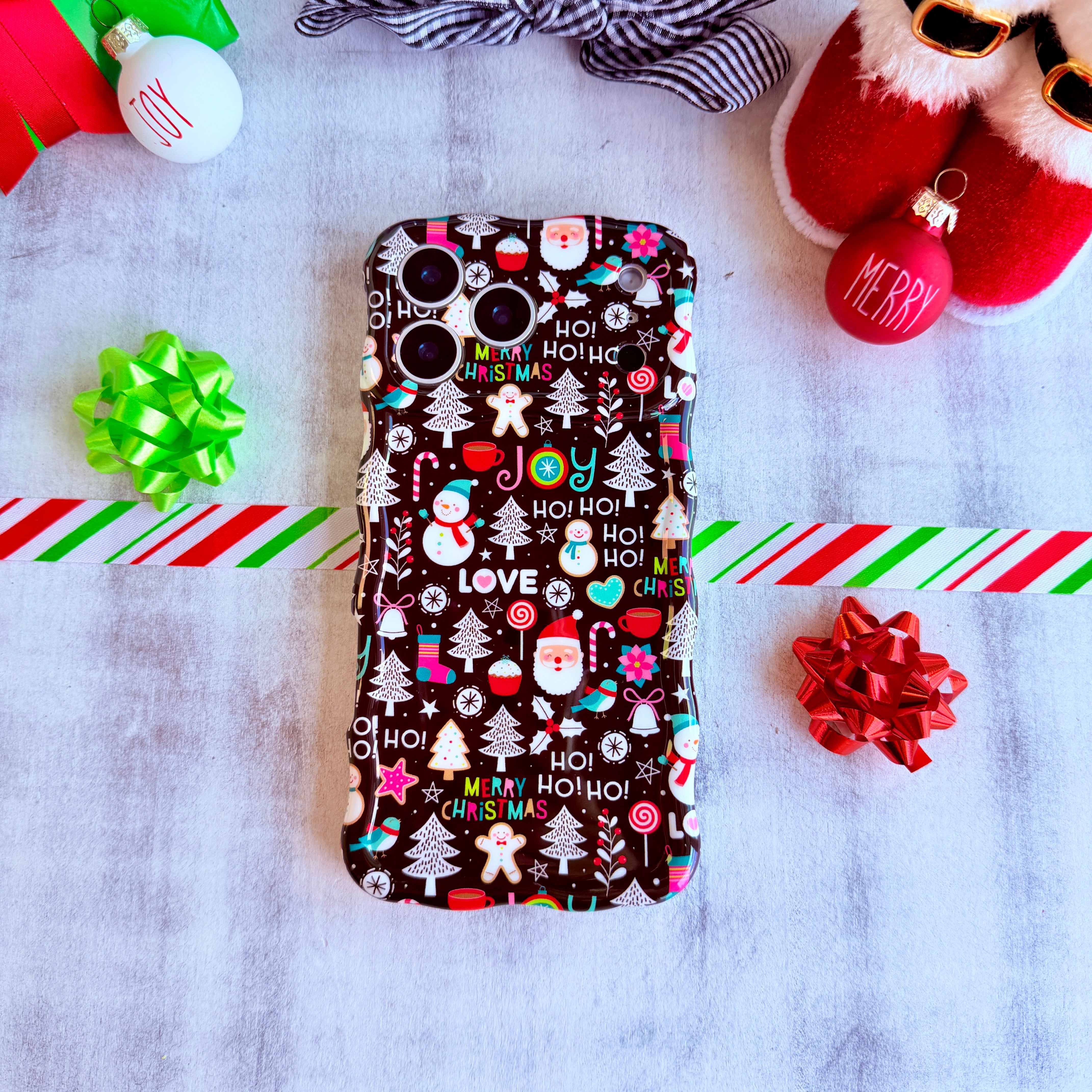 Slim holiday MagSafe iPhone case with Santa, cookies, and JOY lettering