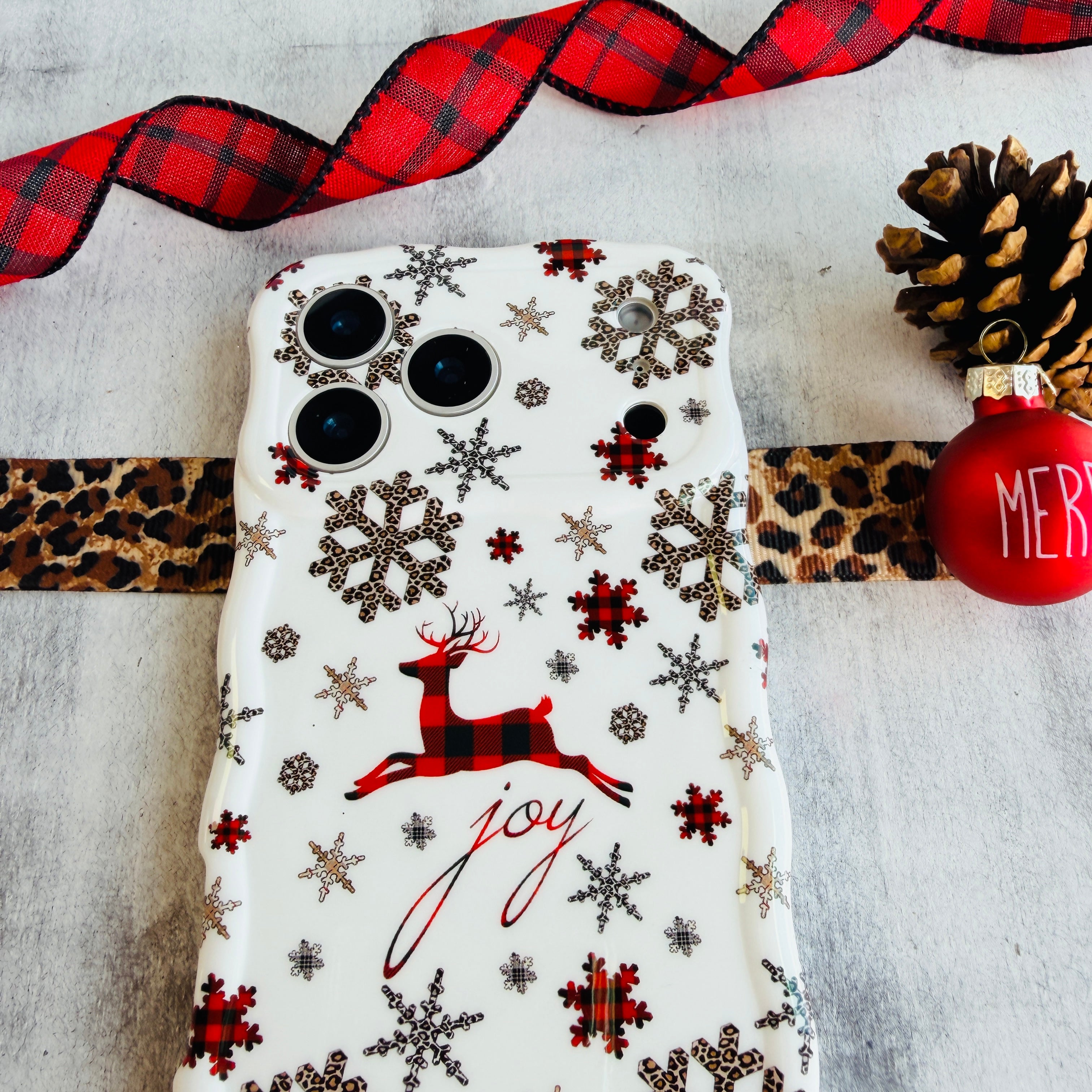 White Christmas iPhone case — plaid reindeer, joy script, glossy wavy edges