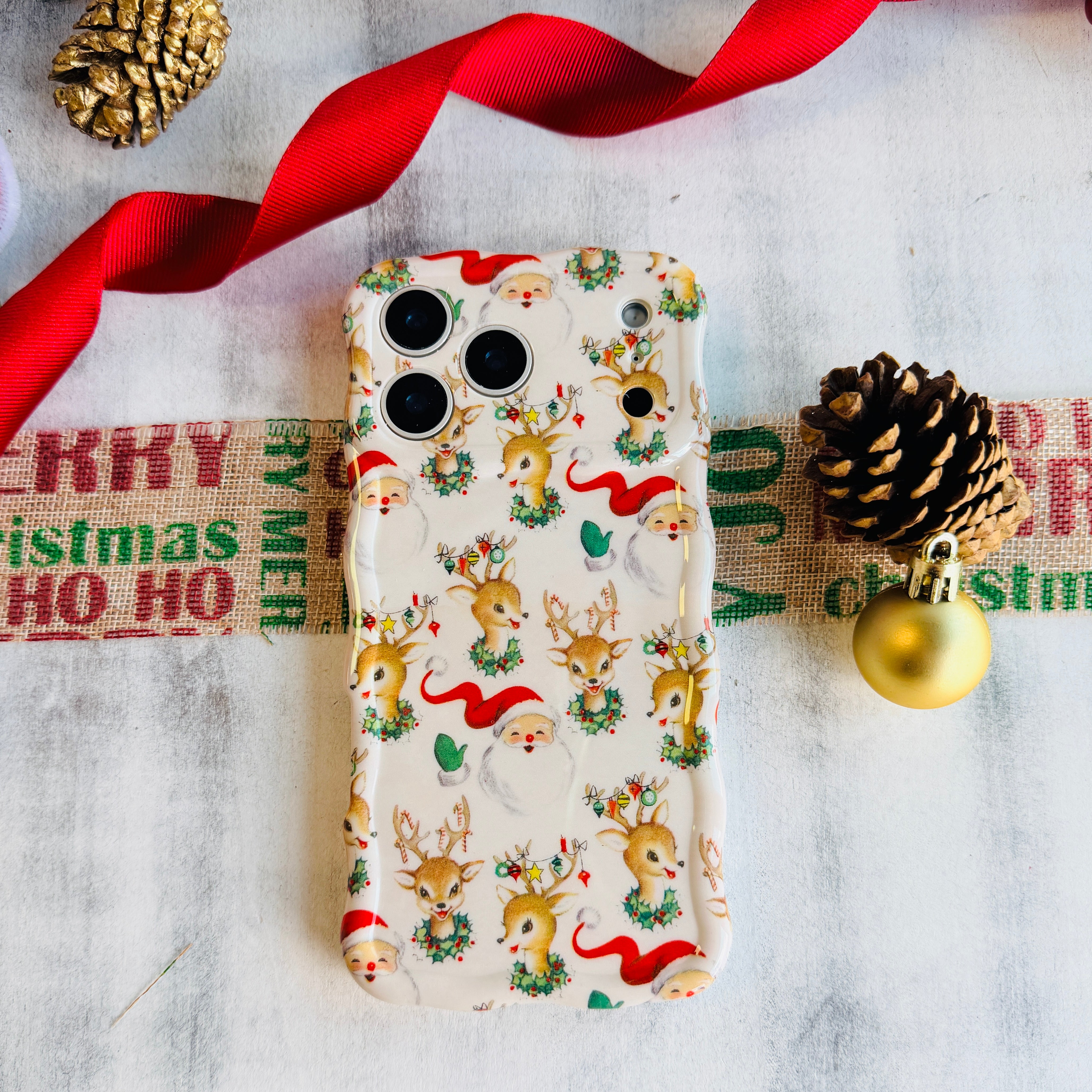 Slim holiday MagSafe iPhone case with retro reindeer and ribbons pattern
