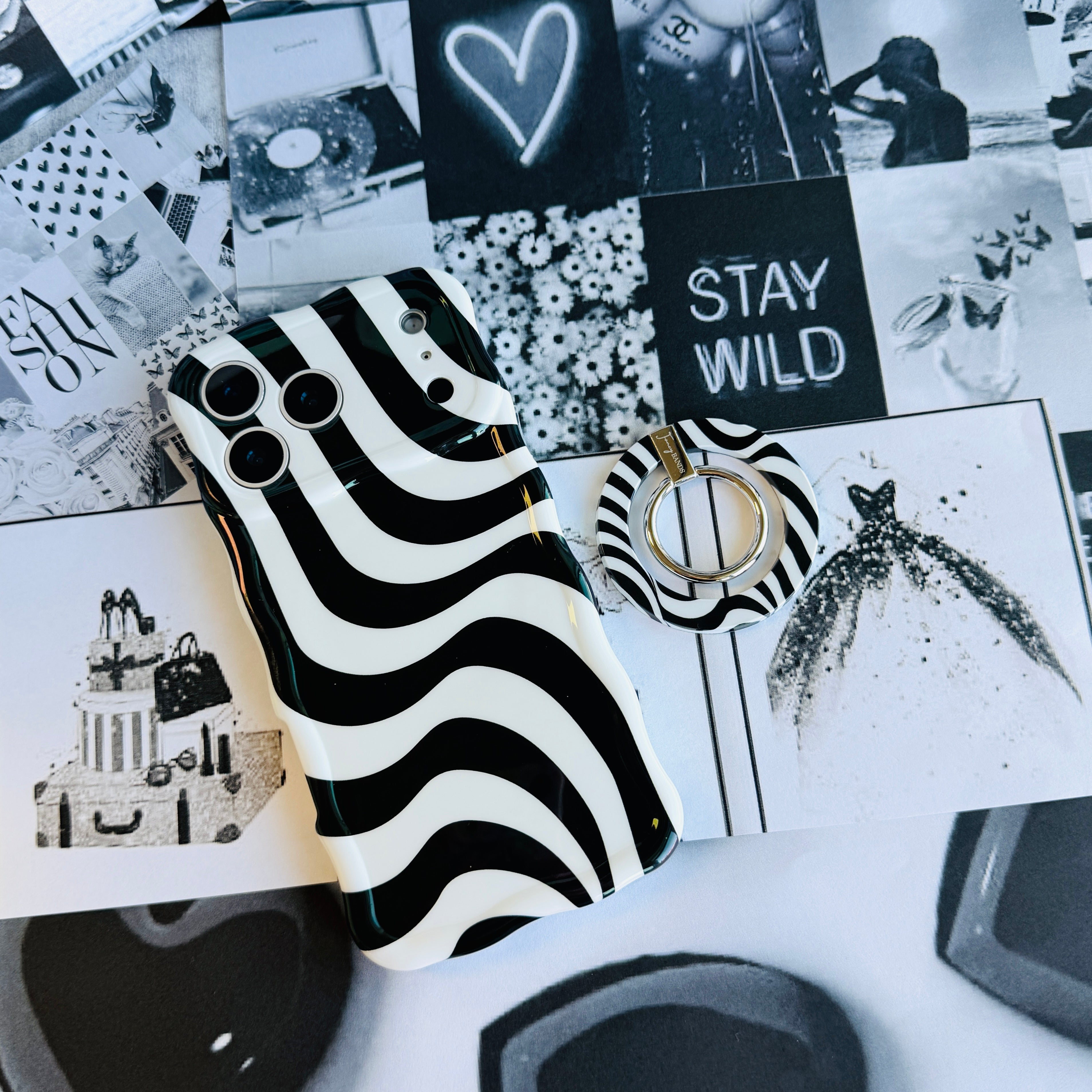 Fifth Ave. Flow monochromatic fluid wave pattern MagSafe phone grip ring with black and white swirling design compatible with iPhone and Samsung