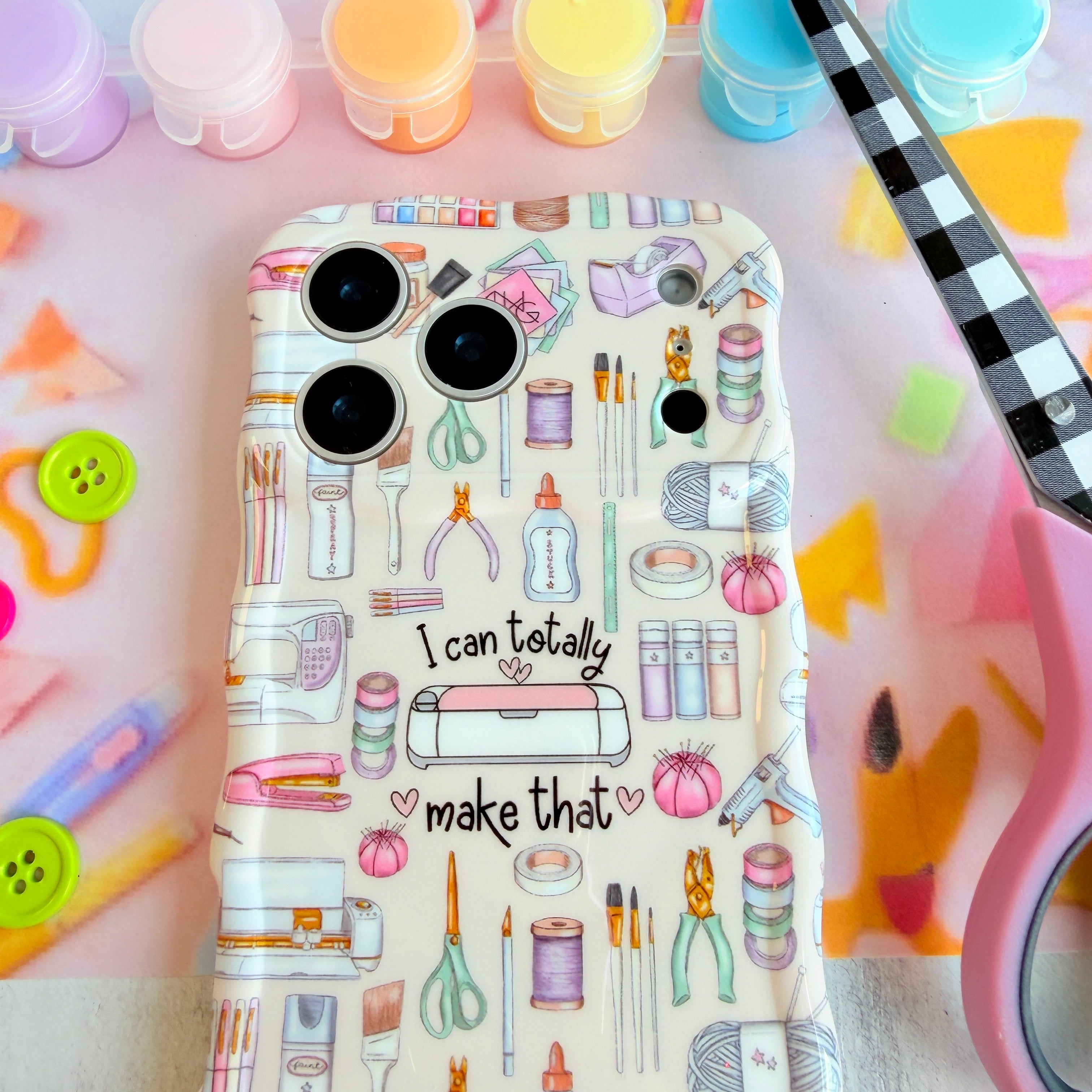 Glossy MagSafe iPhone case with scissors, brushes and yarn design