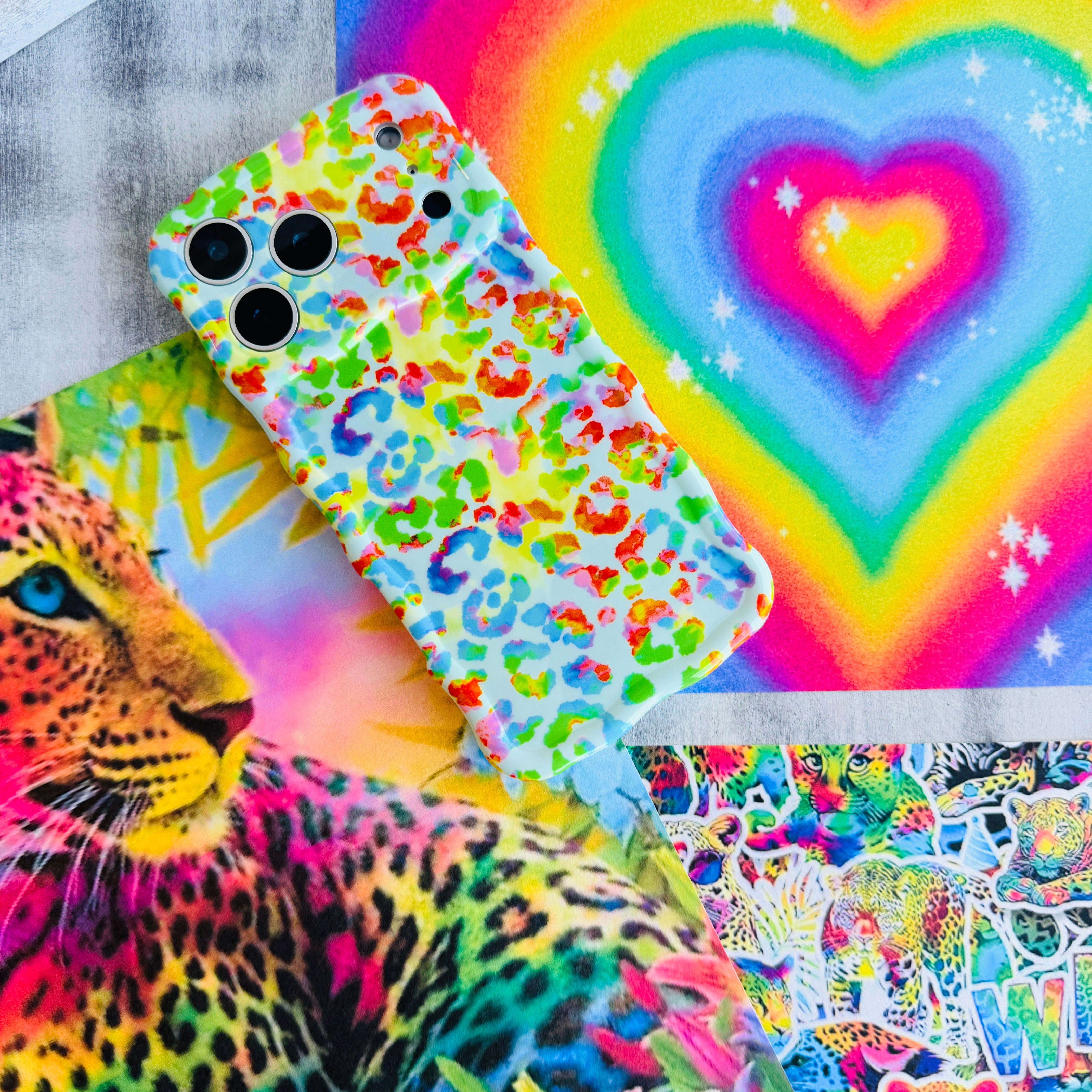 Wavy iPhone case featuring a vibrant neon rainbow leopard print with a high-gloss finish.