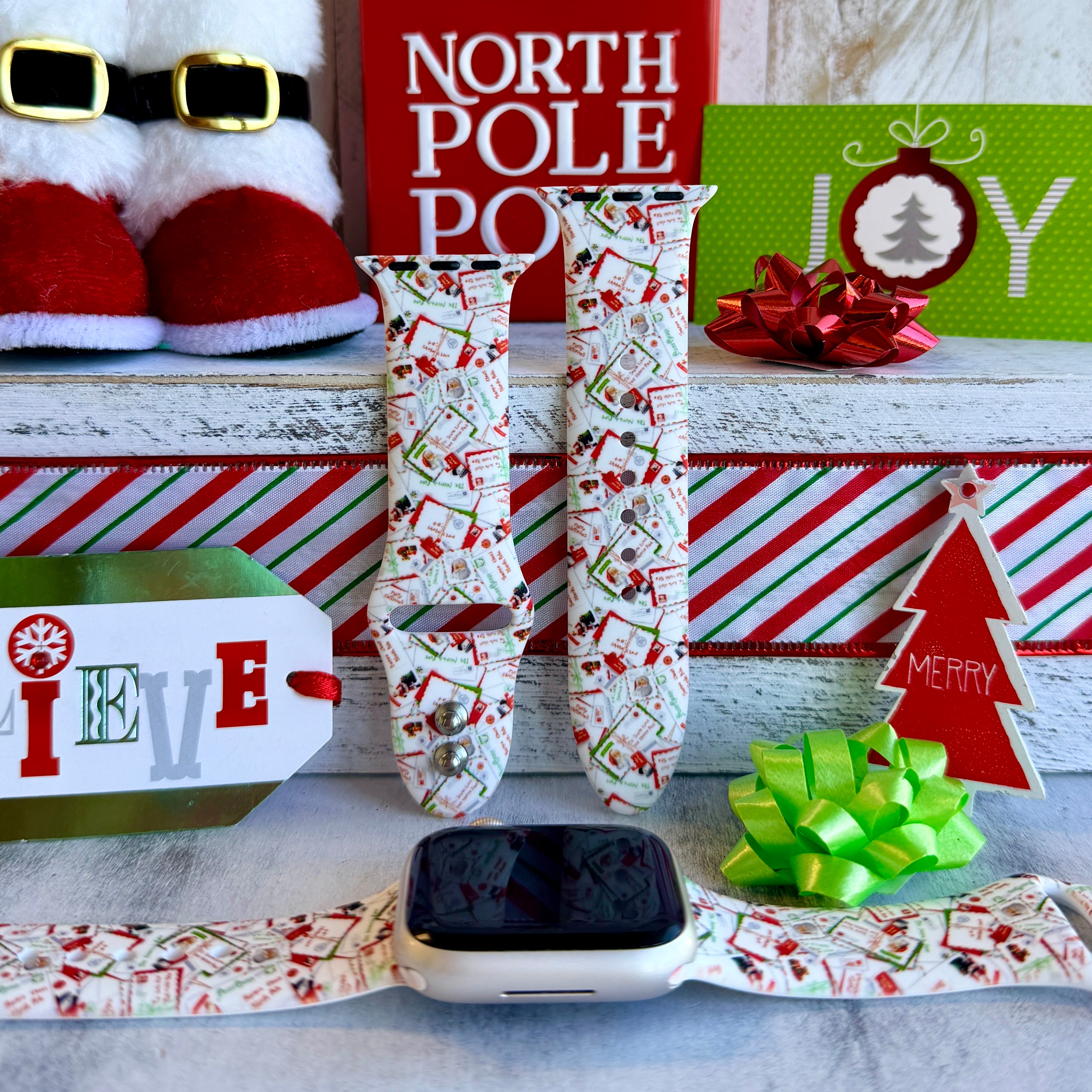 Letters to Santa silicone Apple Watch strap with red, green, and white Christmas mail design on wrist