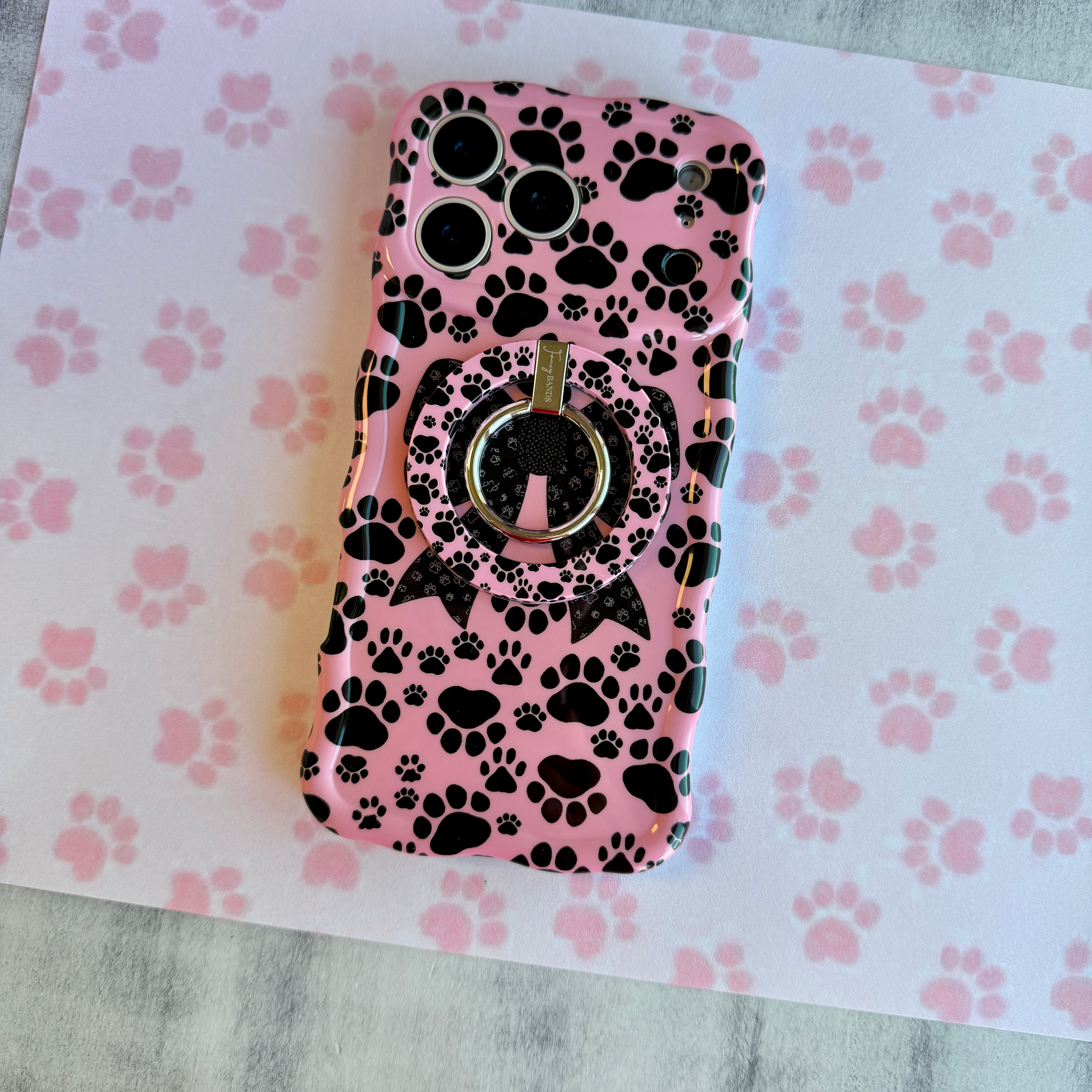 Pretty Little Paws pattern MagSafe phone grip ring with black paw prints on a pink background compatible with iPhone and Samsung