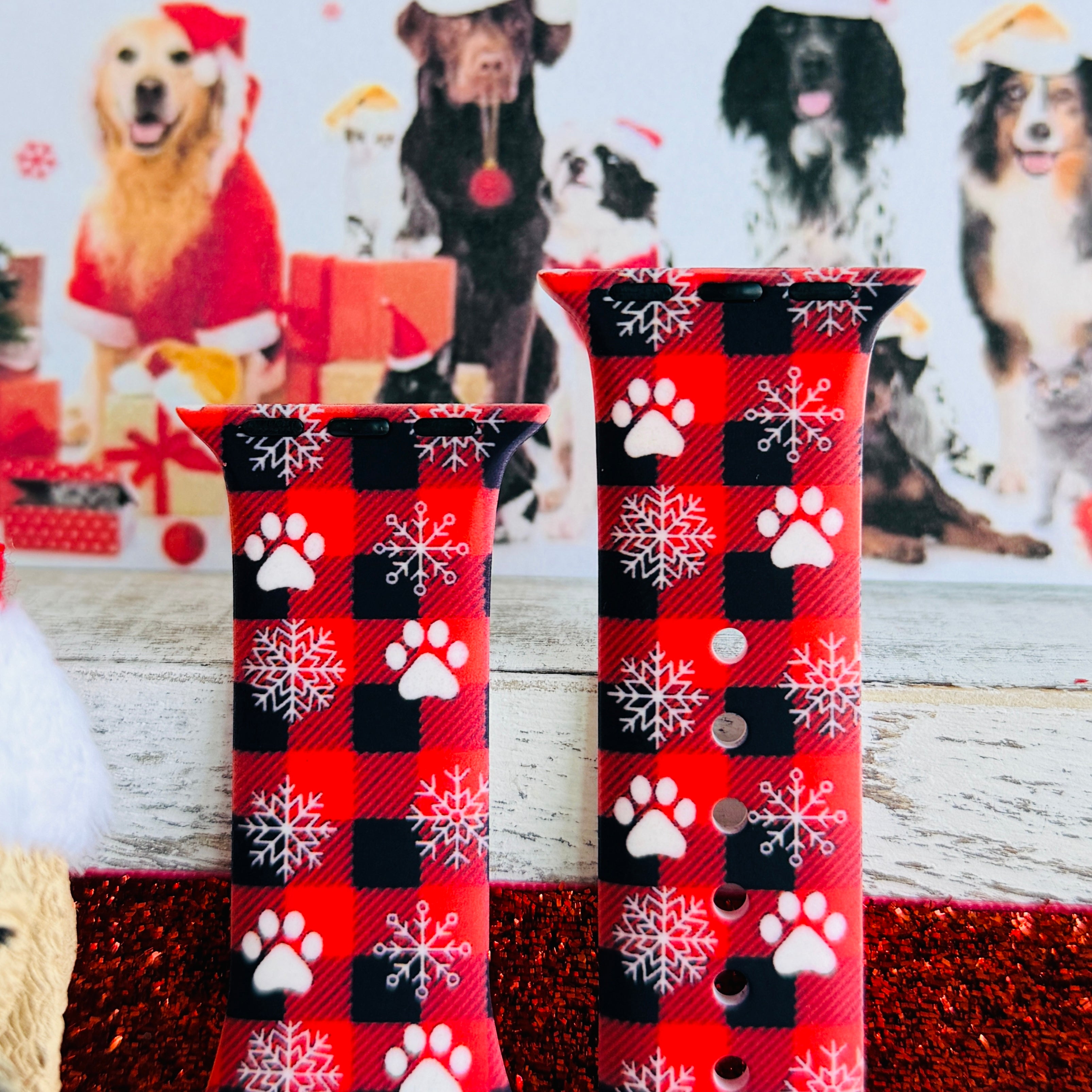 Close-up of Pawliday buffalo plaid pattern with white paw prints and snowflakes on Apple Watch silicone band