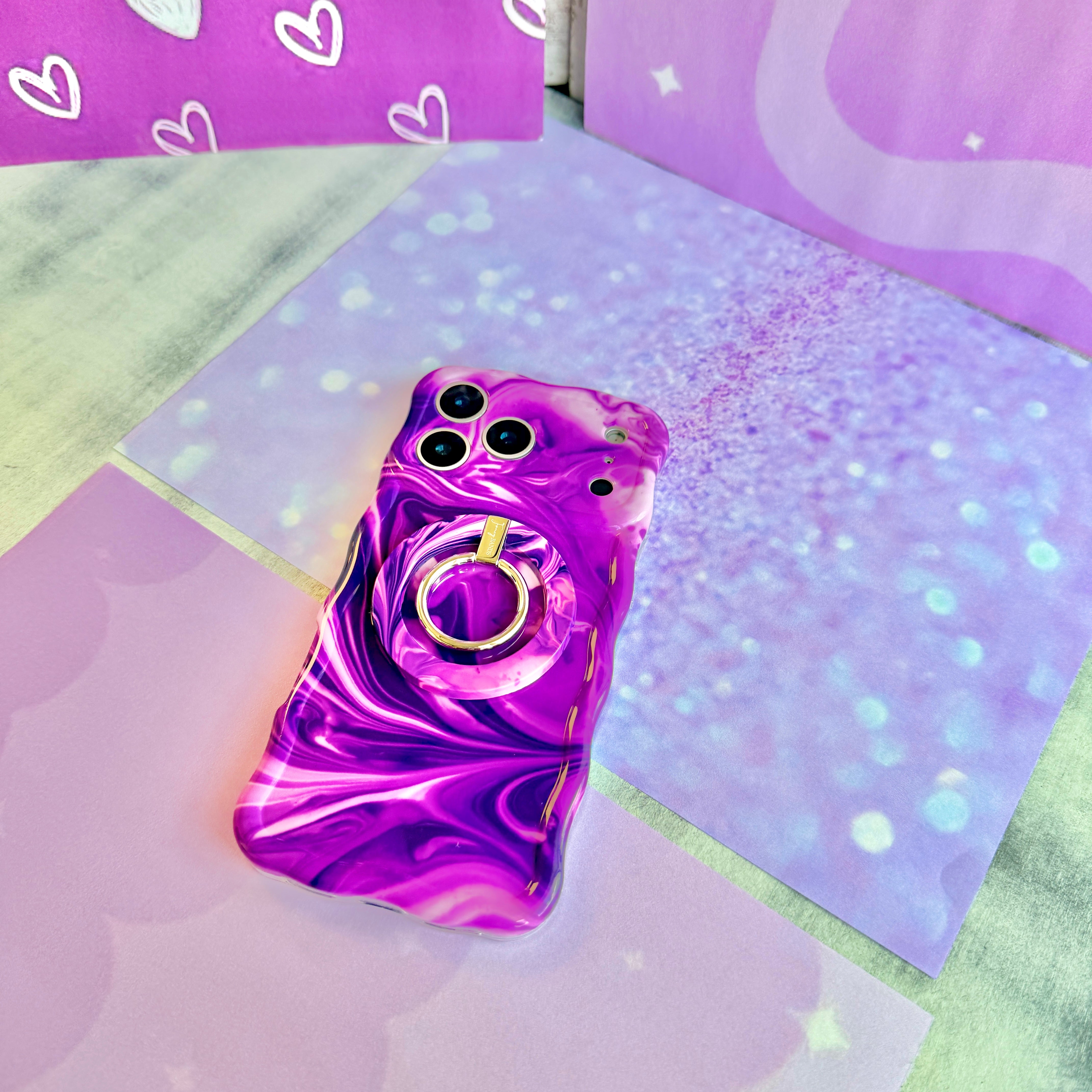 Grape Crush Wavy Luxe MagSafe iPhone case with a glossy purple liquid marble swirl design from Fancy Bands