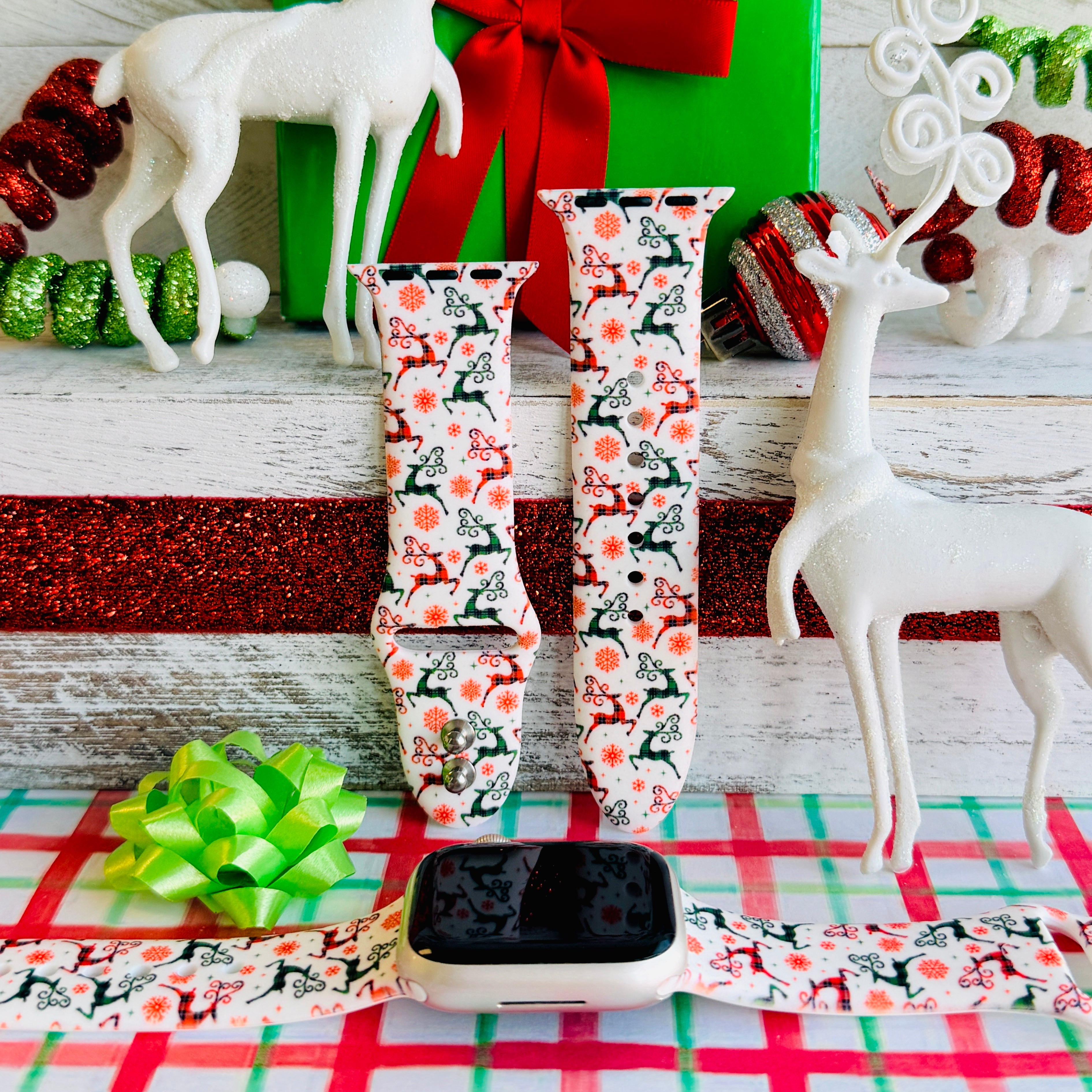 Reindeer Waltz Apple Watch band with dancing reindeer in red and green on white background with Christmas decorations