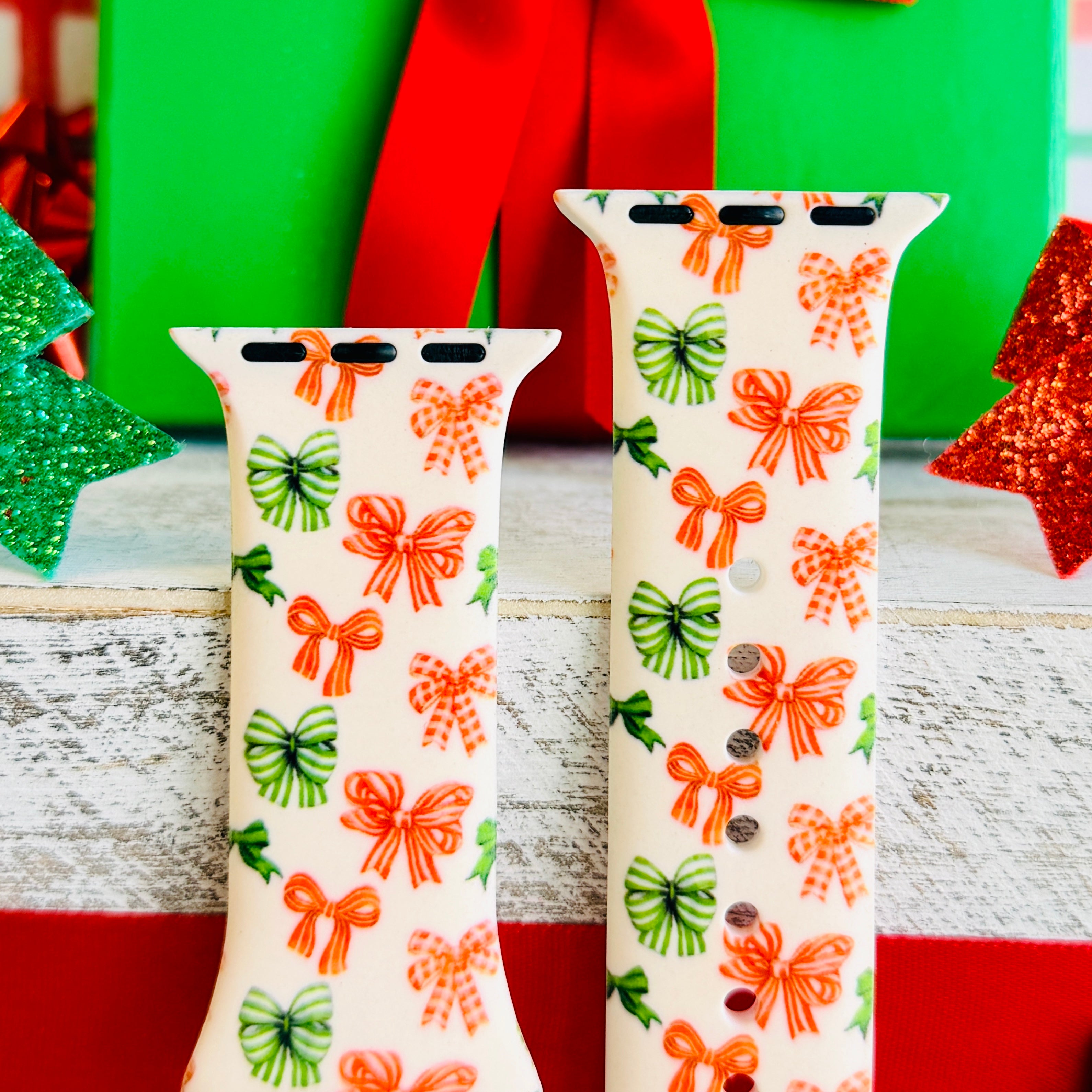 Close-up of Jingle Bows print showing festive ribbon bows with polka dots on Apple Watch silicone band