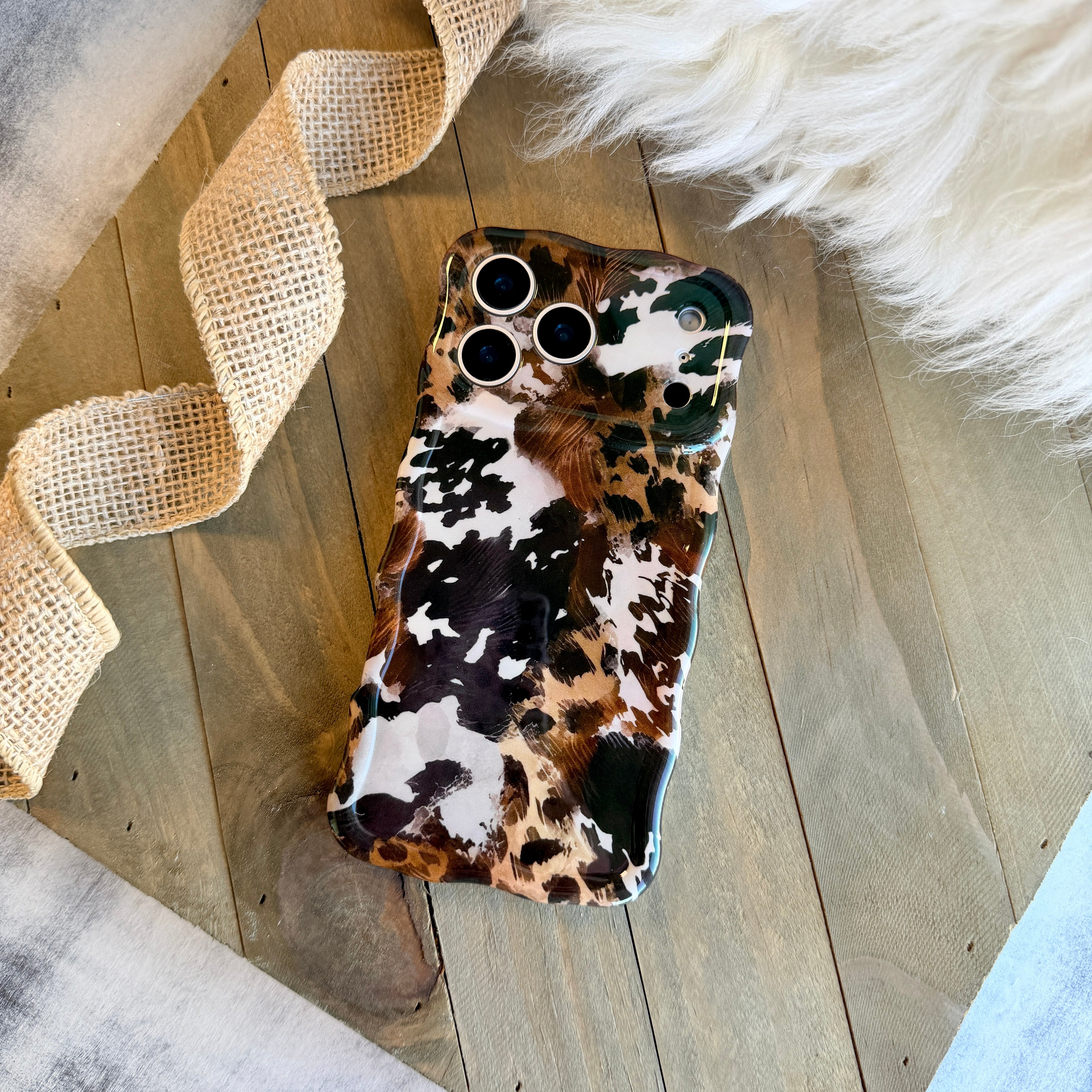 Rodeo Wild MagSafe iPhone case with cowhide and leopard print mix by Fancy Bands