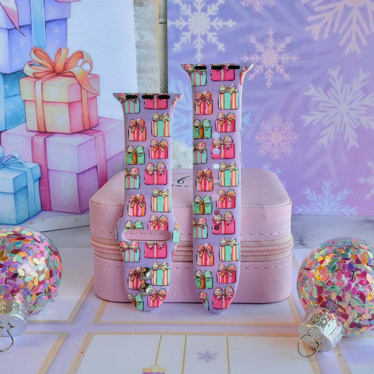Both straps of the No Peeking, Darling silicone Apple Watch band propped on a pink jewelry box with confetti ornaments
