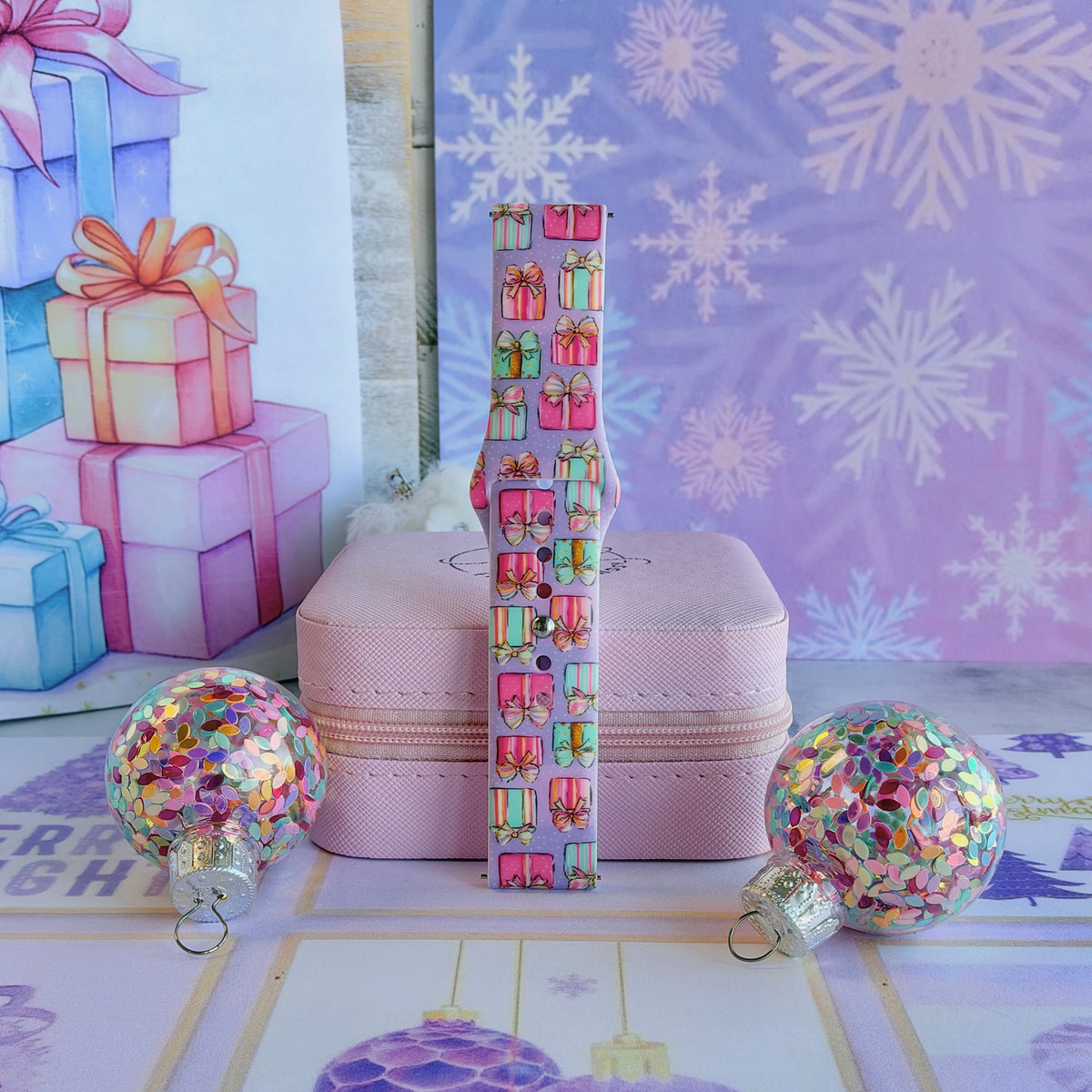 No Peeking, Darling Samsung Galaxy Watch band buckled and standing on a pink jewelry box between glitter ornaments