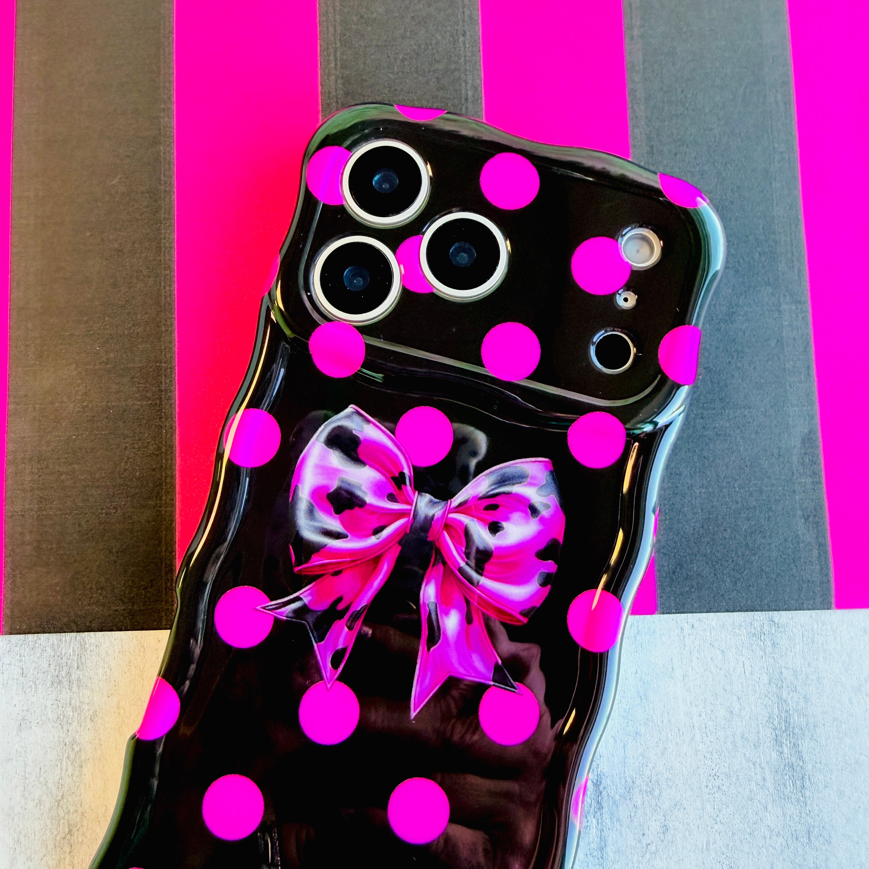 Sweet Spot MagSafe iPhone case with hot pink polka dots and cowhide bow on black by Fancy Bands