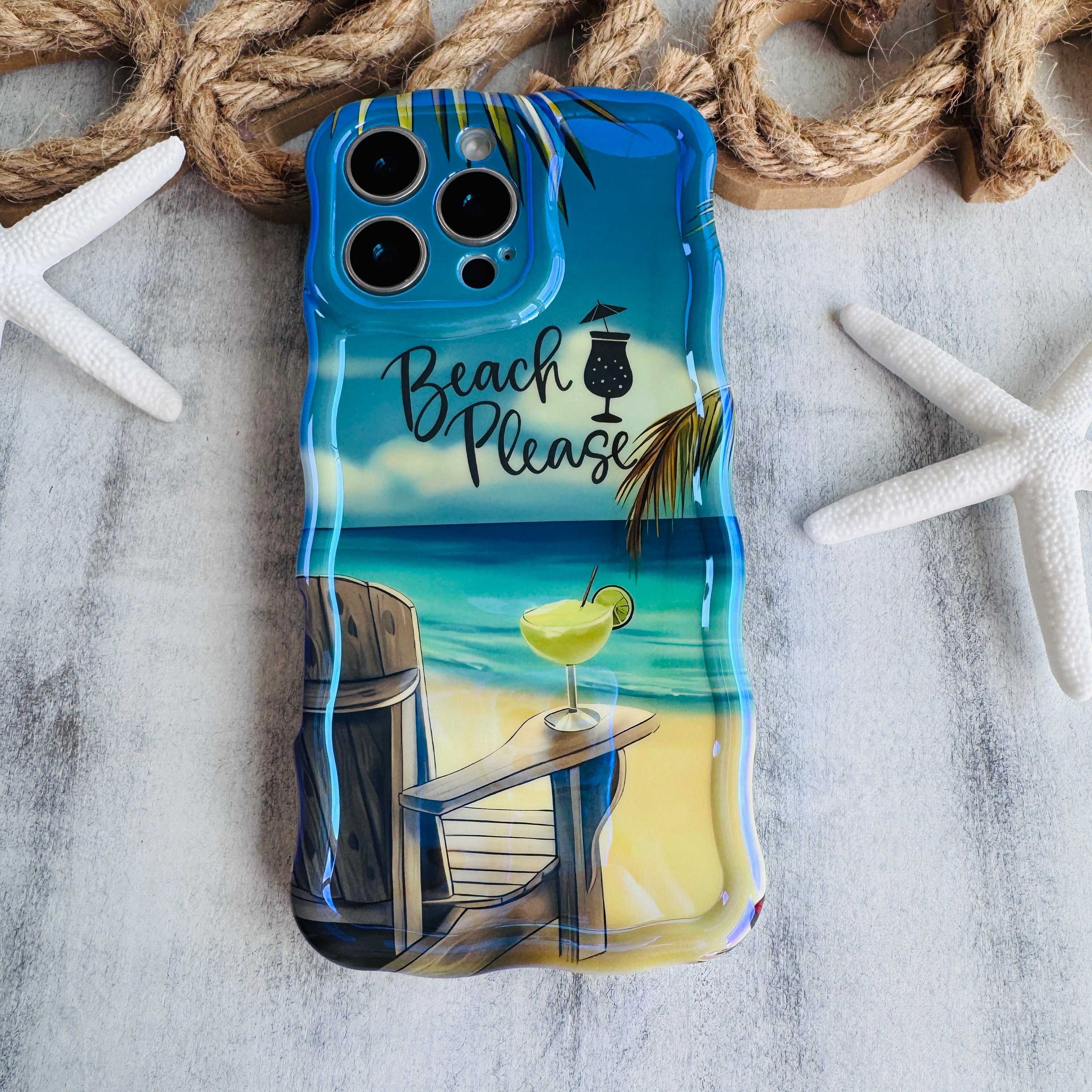 Phone case with beach-themed design on a textured surface with rope and starfish.