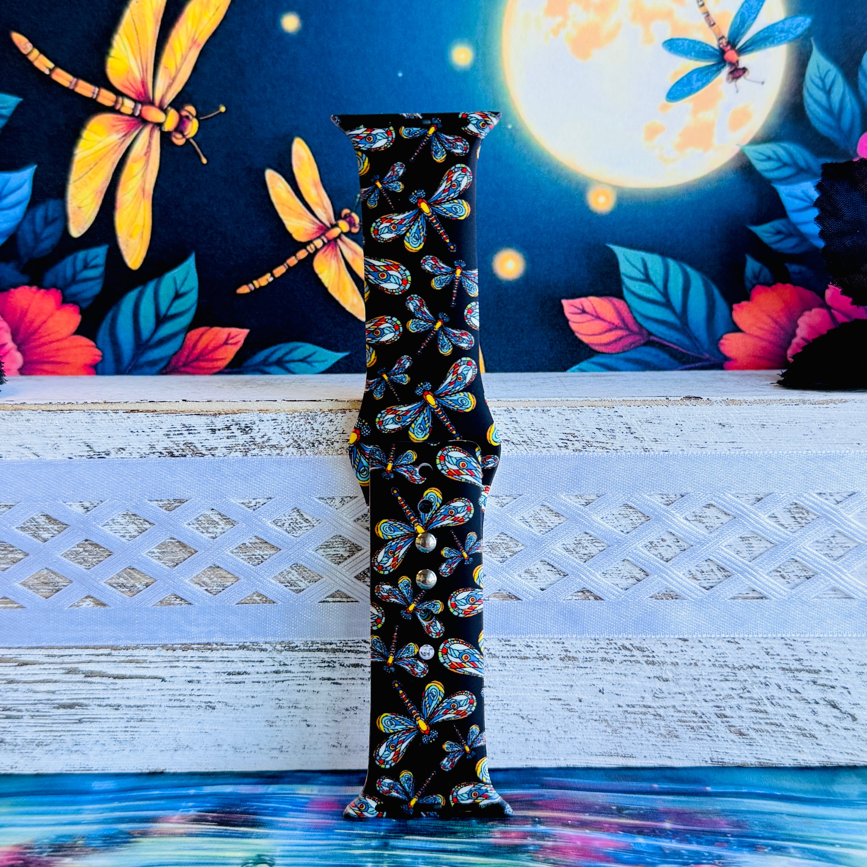Dragonfly Dreams Apple Watch band with colorful paisley-wing dragonflies on black background with moon and nature backdrop