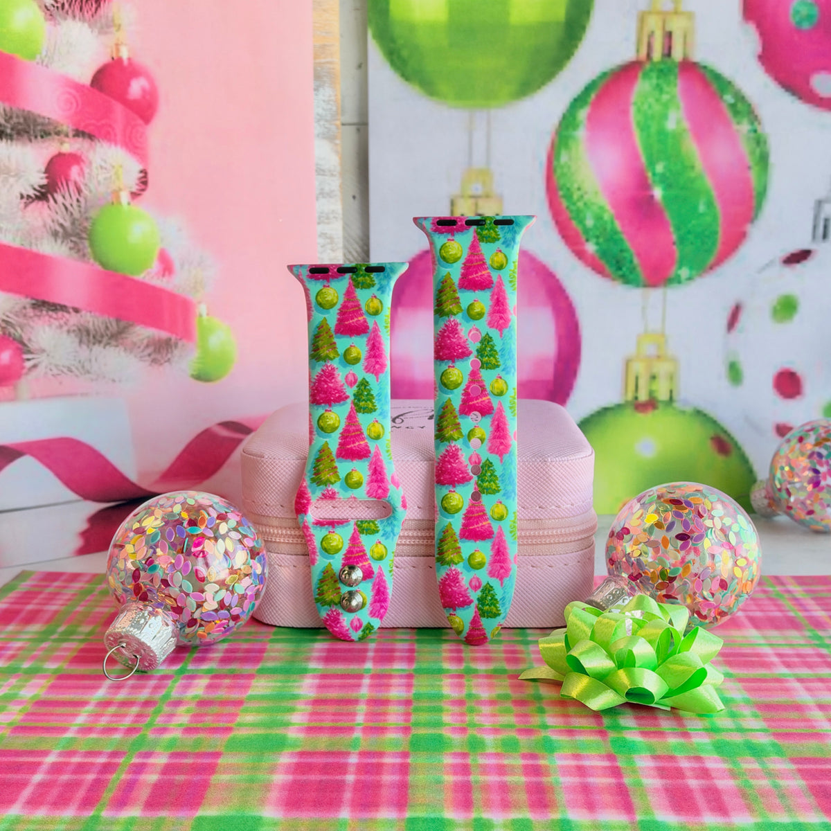 Merry & Bright, Totally! Apple Watch band buckled and standing on a pink jewelry box between confetti ornaments and a lime gift bow