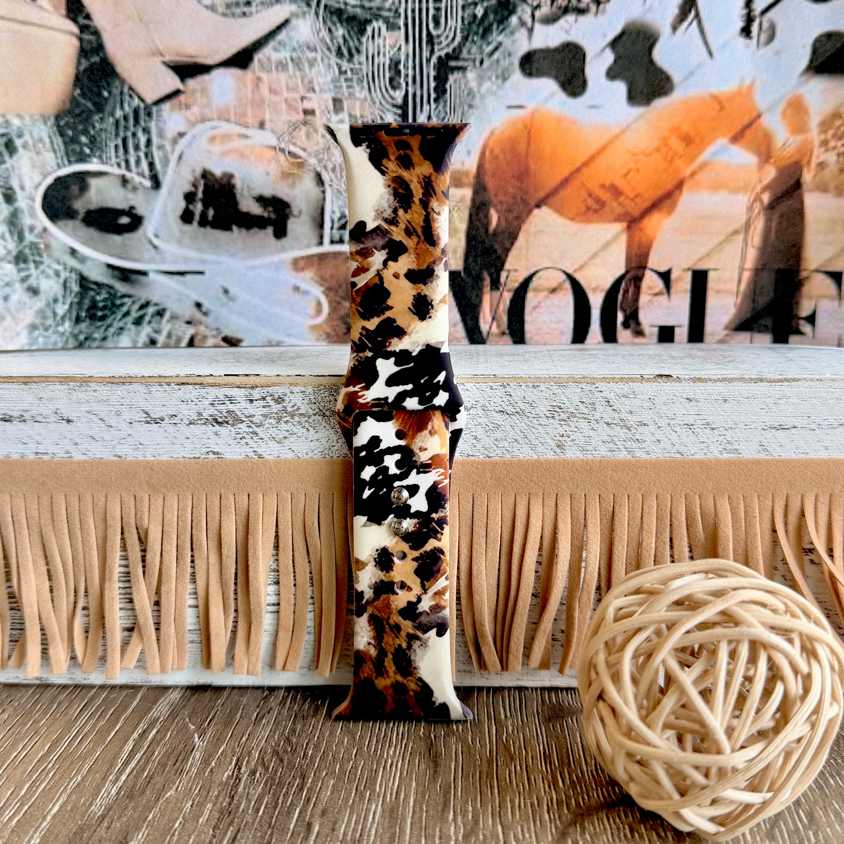 Rodeo Wild Apple Watch band with cowhide and leopard print patterns in brown, black, and cream with Western decor