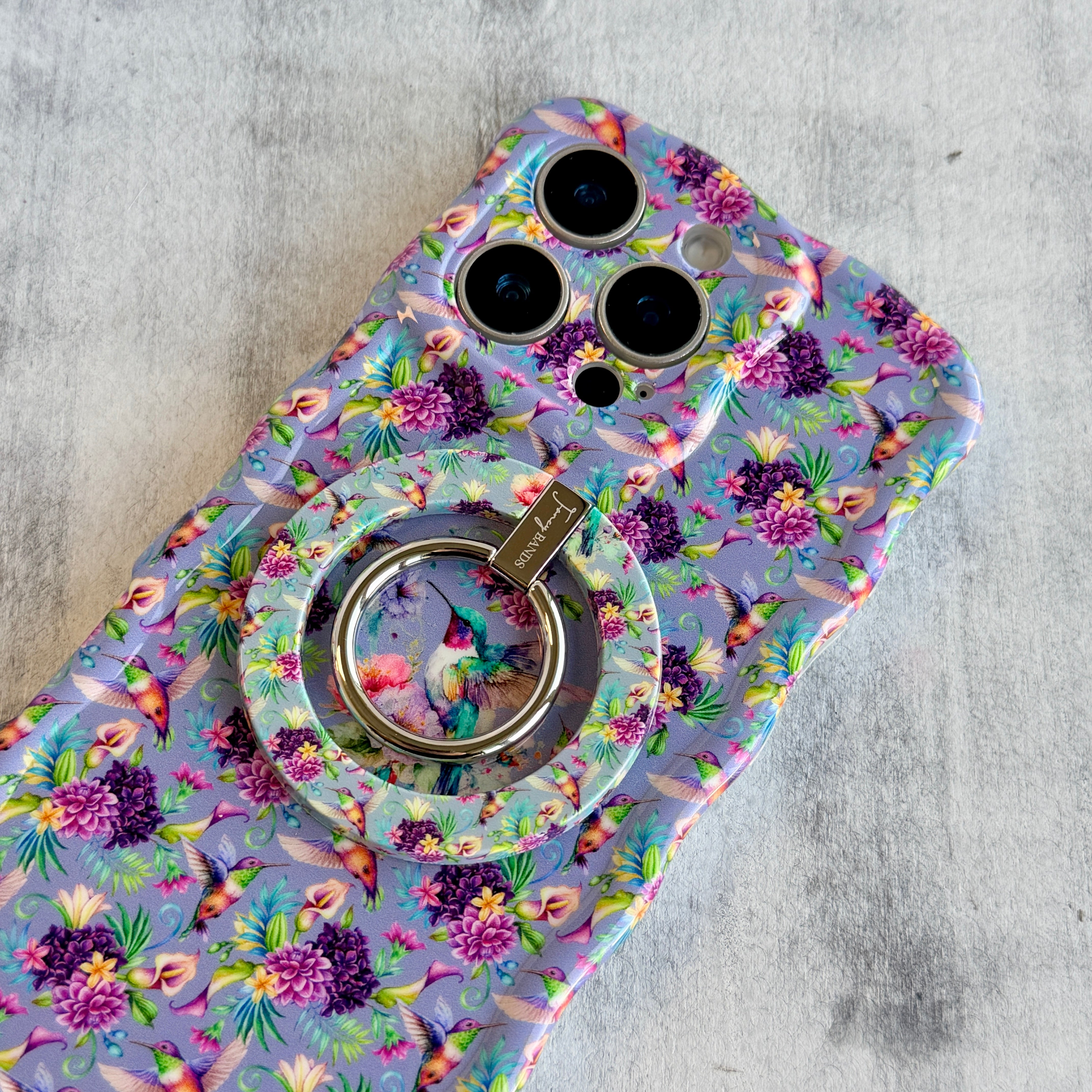 Hummingbird Bliss pattern MagSafe phone grip ring with colorful birds and purple flowers on lavender background compatible with iPhone and Samsung