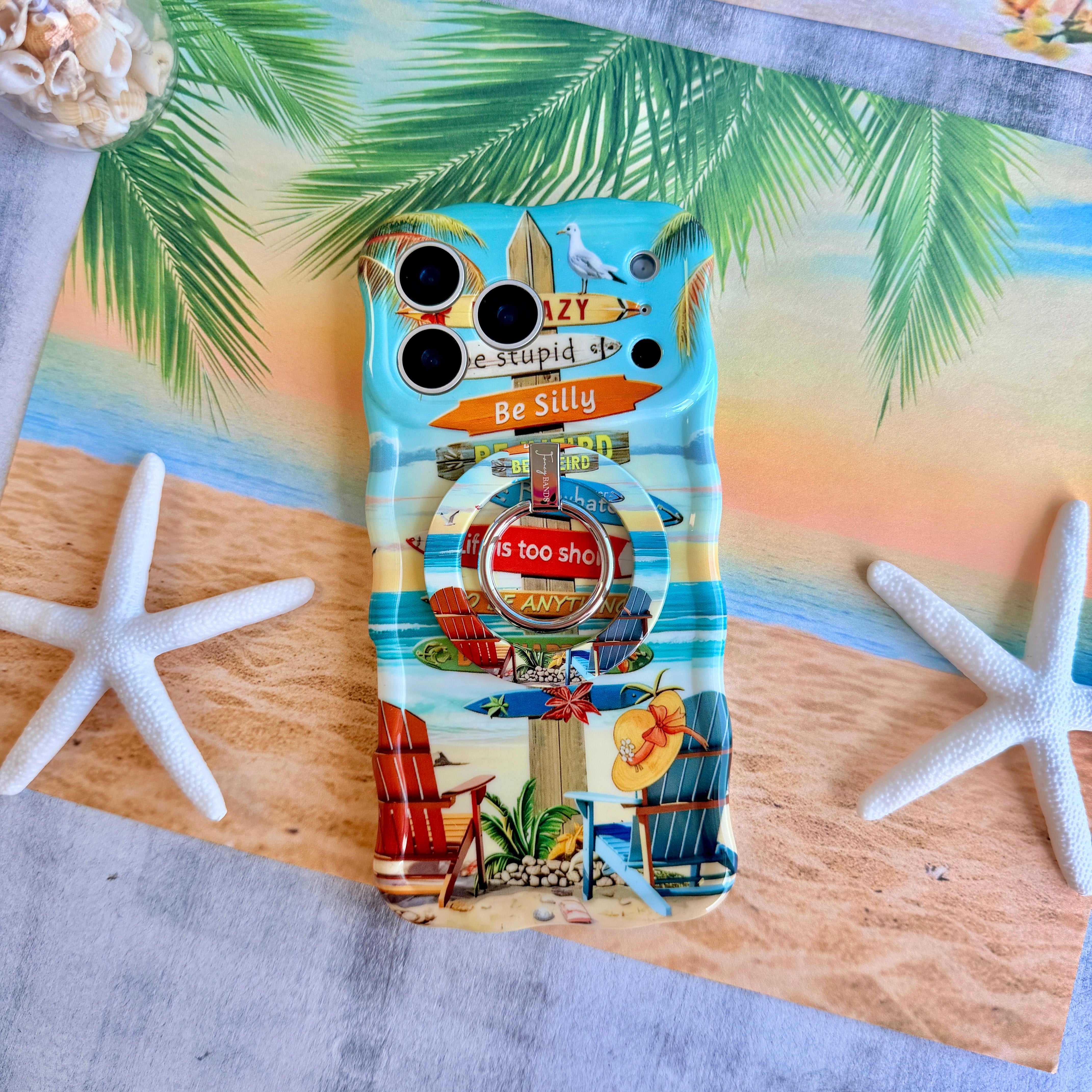 Trendy wavy iPhone case featuring a beach scene with colorful surfboard signs and a "Life is too short to be happy" quote with a high-gloss finish.