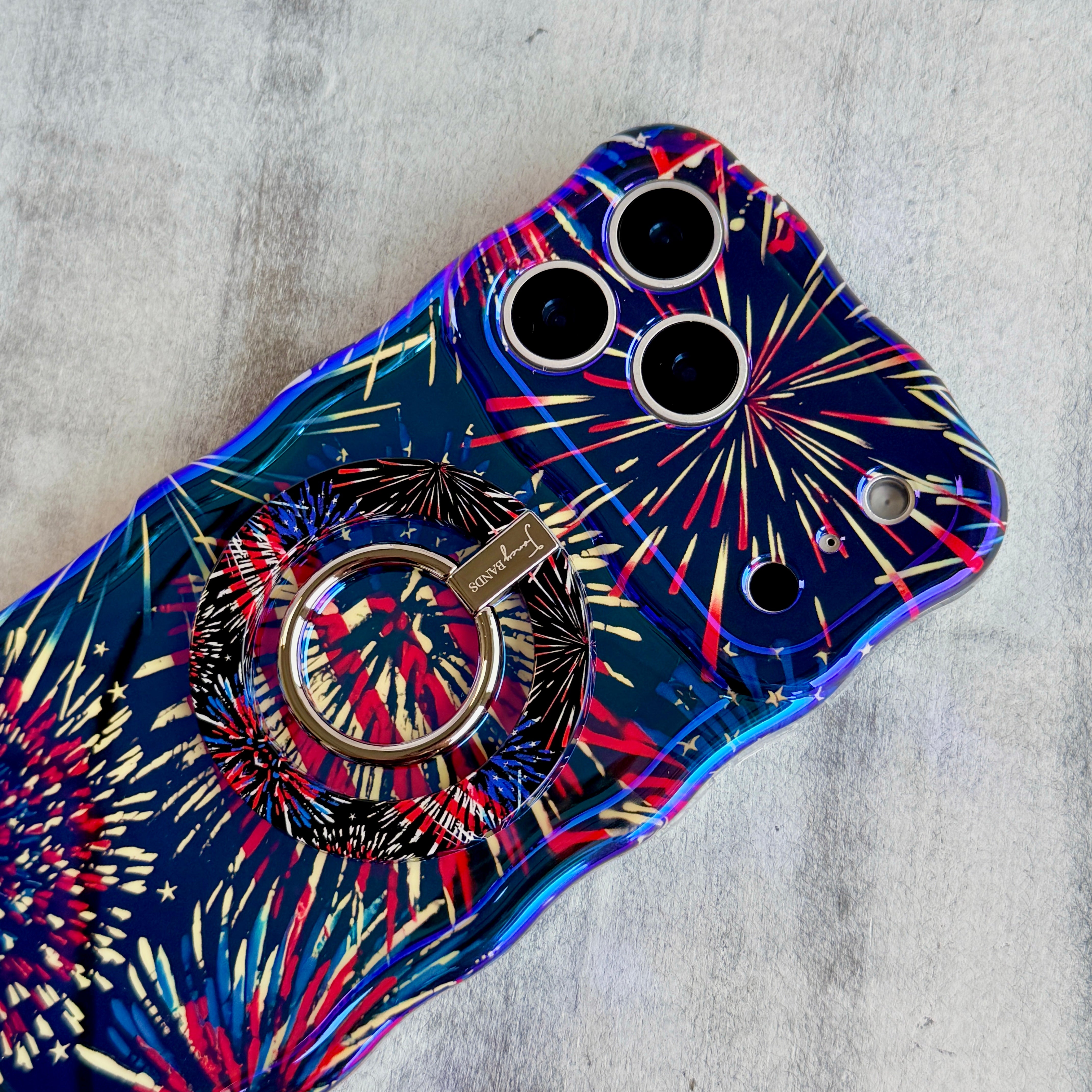 USA Fireworks patriotic pattern MagSafe phone grip ring with red white and blue fireworks on black background compatible with iPhone and Samsung