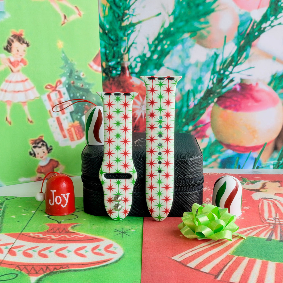 Both Tinsel & Stardust Apple Watch band straps on a black jewelry box in front of vintage Christmas wrapping paper