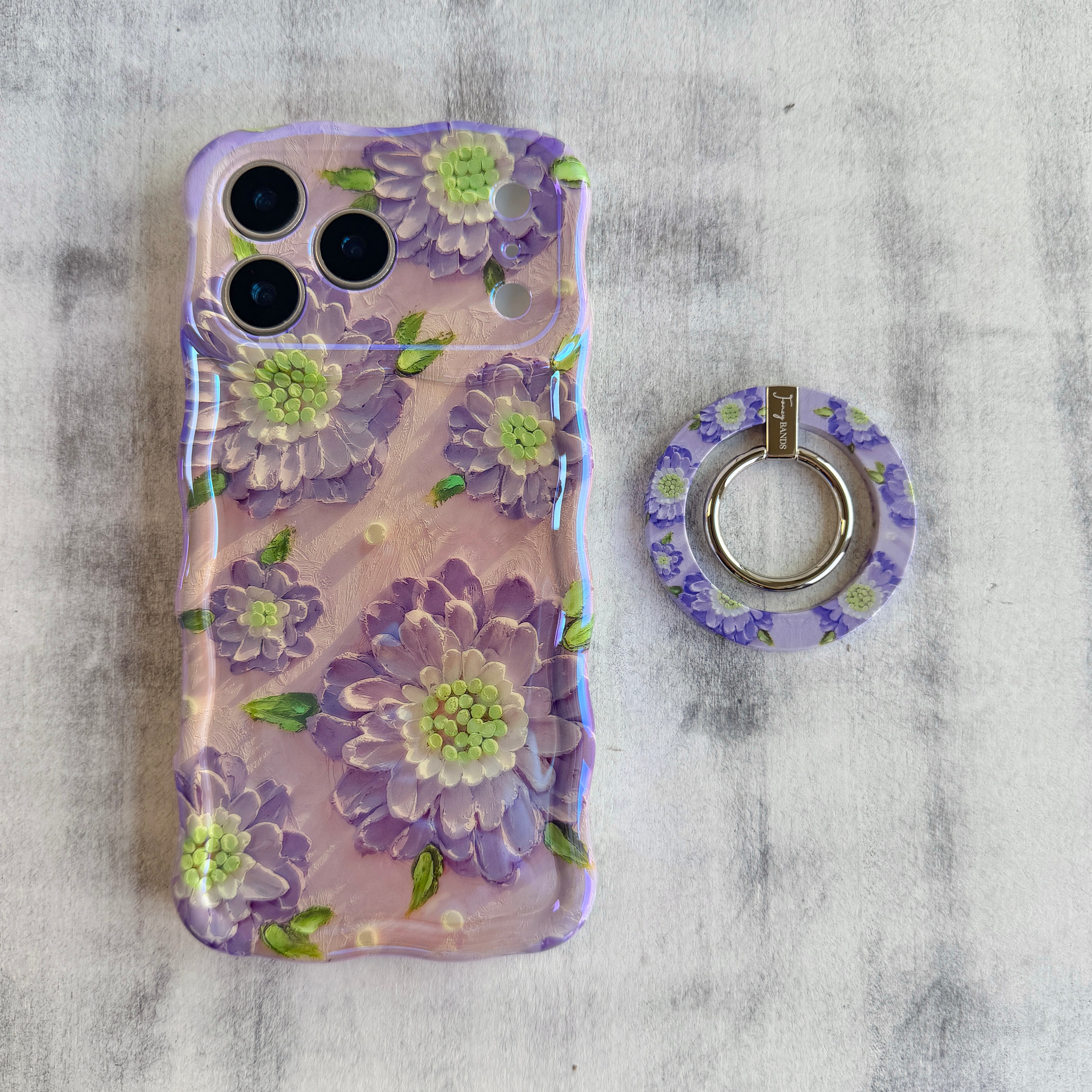 Purple Wildflower botanical pattern MagSafe phone grip ring with delicate purple pink and yellow flowers on white background compatible with iPhone and Samsung