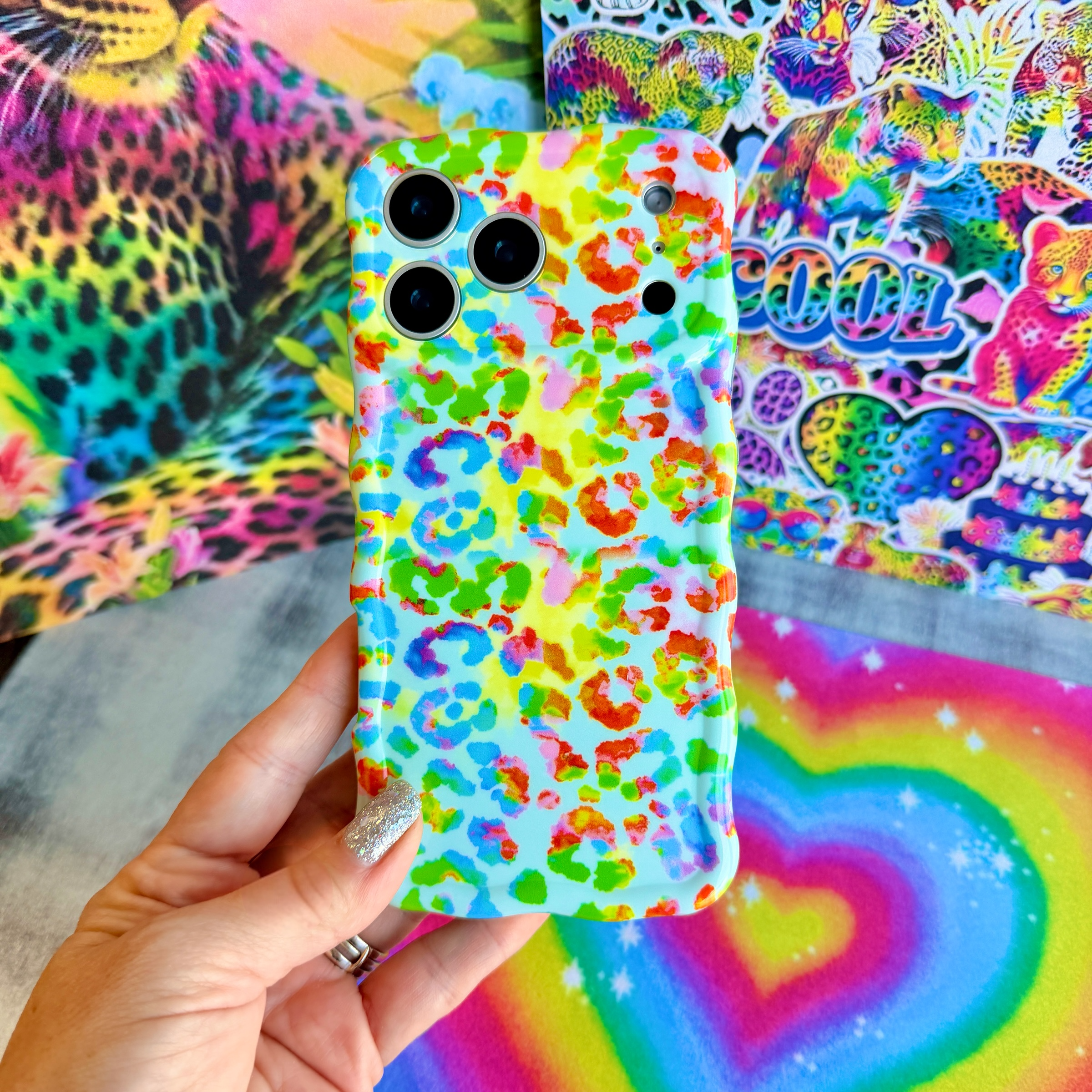 Wavy iPhone case featuring a vibrant neon rainbow leopard print with a high-gloss finish.
