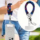 Neon Taffy scrunchie phone wrist strap worn on the wrist with a phone hanging at the hip, plus a close-up inset of the neon marble strap, clasp and attachment tab.