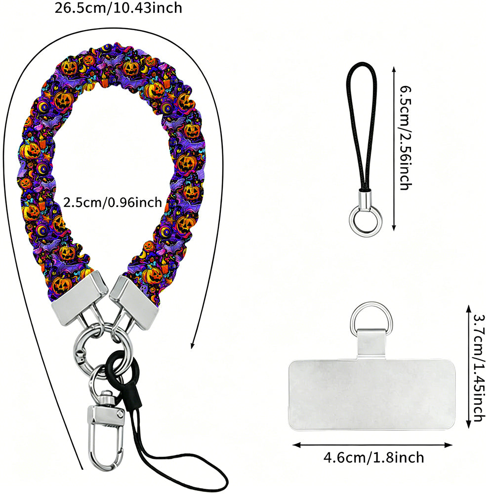 Jack-O-Lantern Jive scrunchie phone wrist strap shown with its metal clasp and phone attachment tab, purple fabric printed with glowing pumpkins and ghosts.
