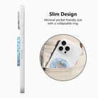Side view of the slim Twinkle All The Way grip ring with collapsible ring, and a phone with the Christmas lights grip sliding into a jeans pocket
