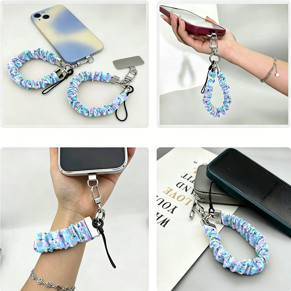 Four views of the Twinkle All The Way scrunchie phone wrist strap: with its phone tab, dangling from a phone in hand, worn on the wrist, and clipped to a pouch zipper