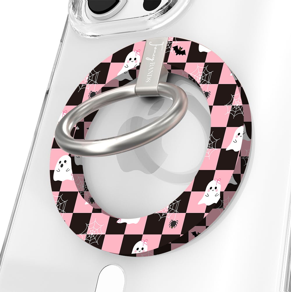 Hey Boo, Looking Cute Hold It Fancy MagSafe grip ring shown on a clear iPhone case, pink and black checkerboard with white ghosts around the silver ring.